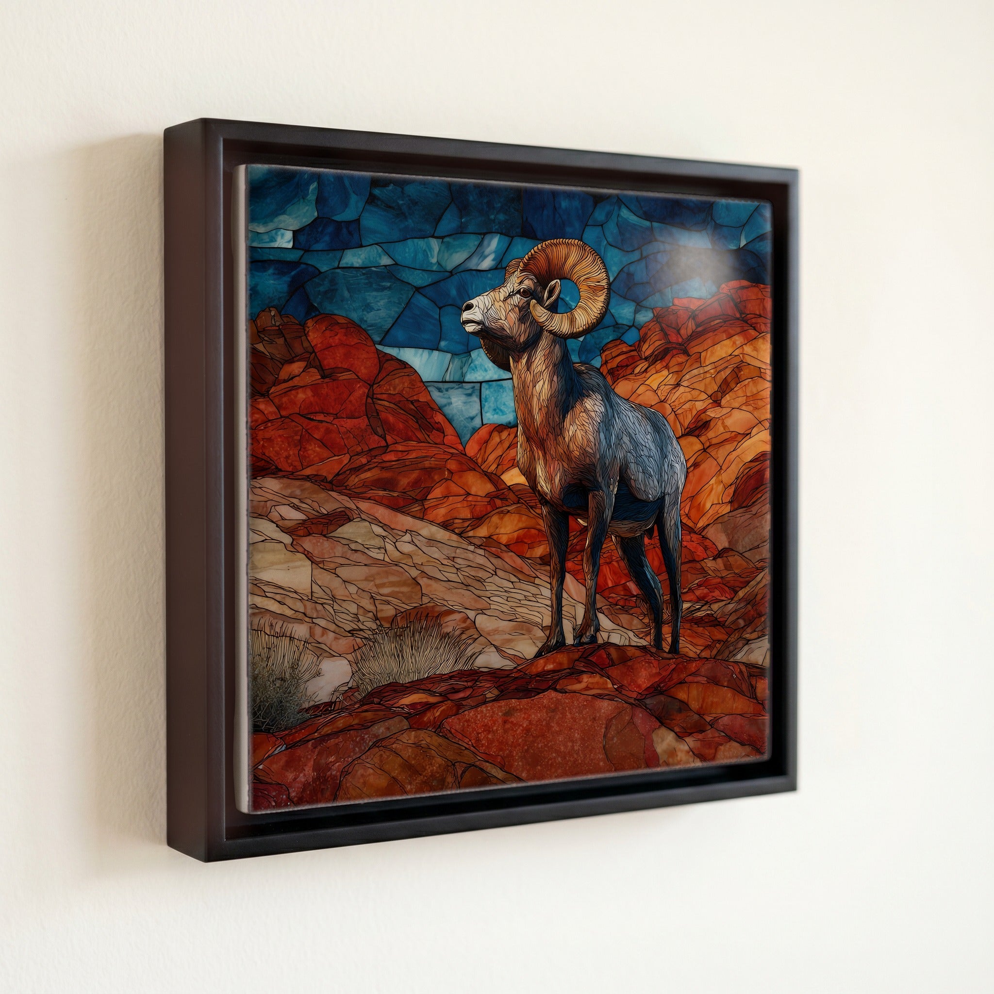 a desert bighorn ram on a sandstone ridge — front