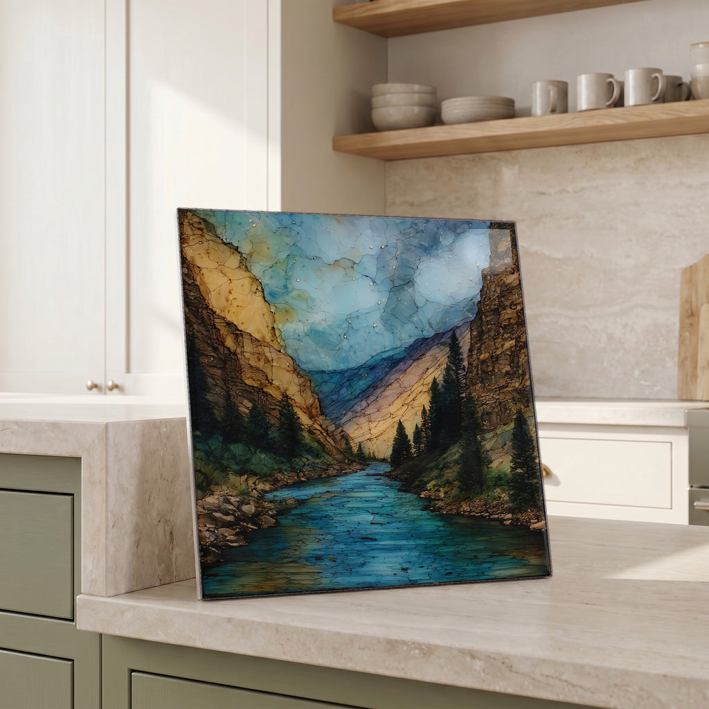 Beside the kettle, propped on the counter.