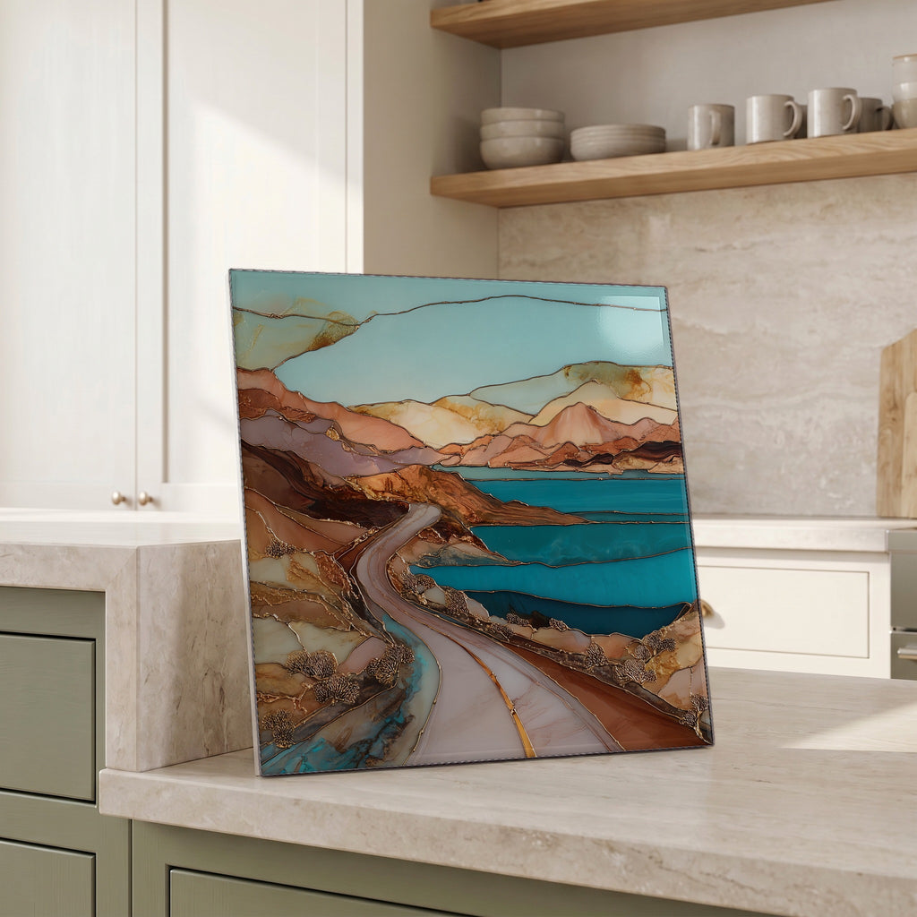 Beside the kettle, propped on the counter.