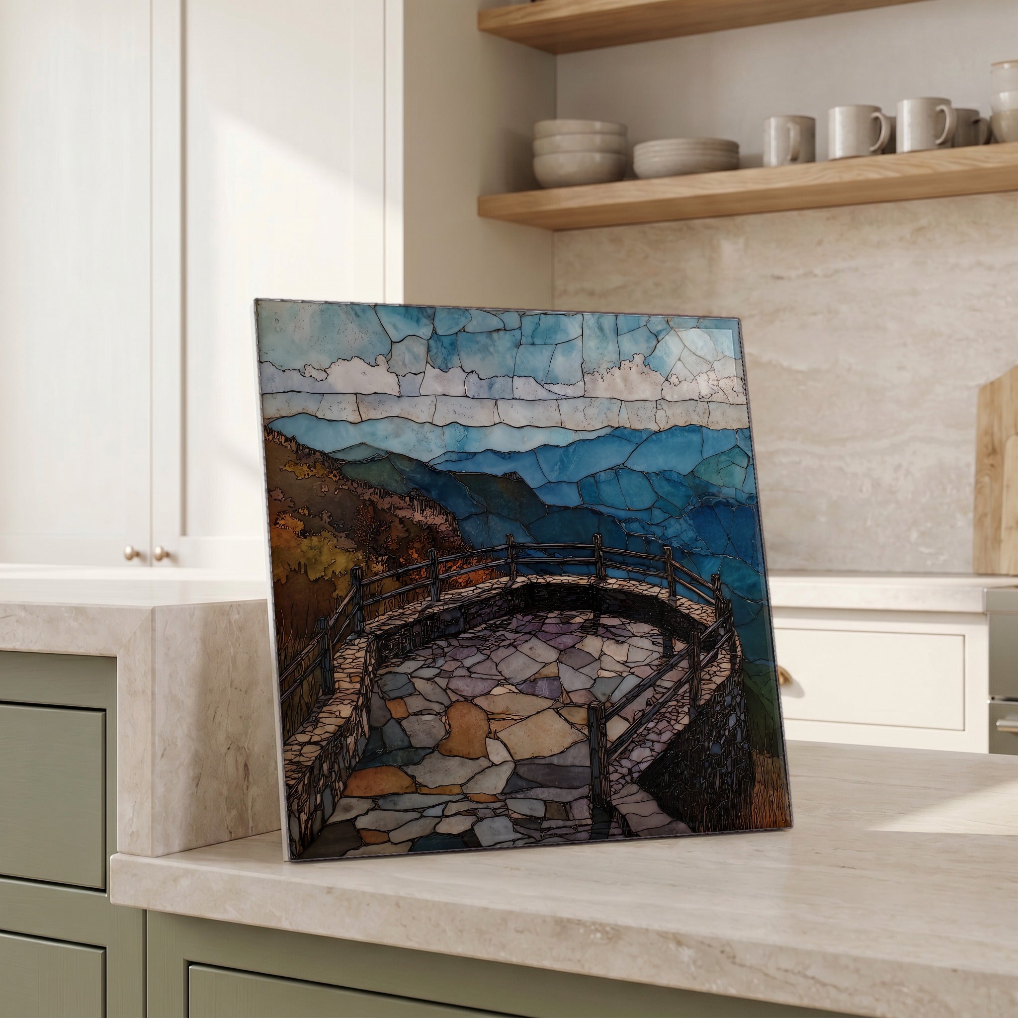 Beside the kettle, propped on the counter.