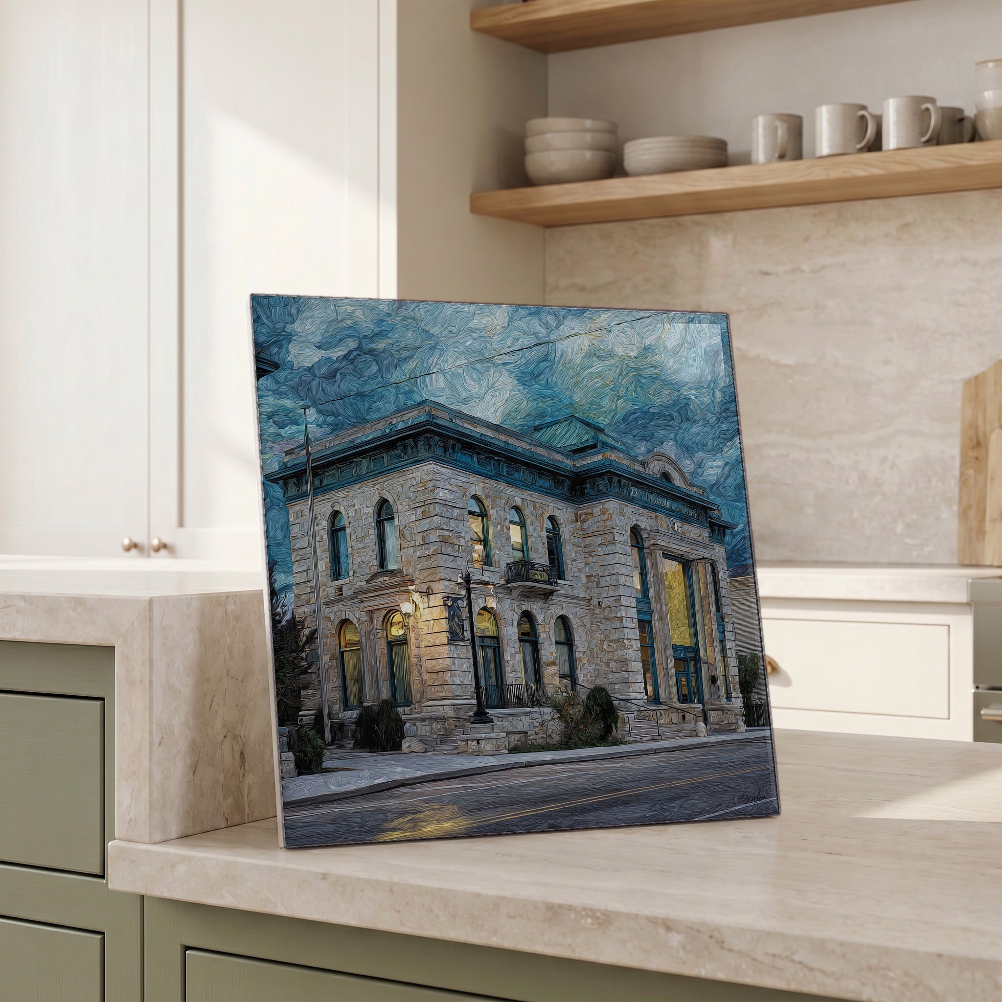 Beside the kettle, propped on the counter.
