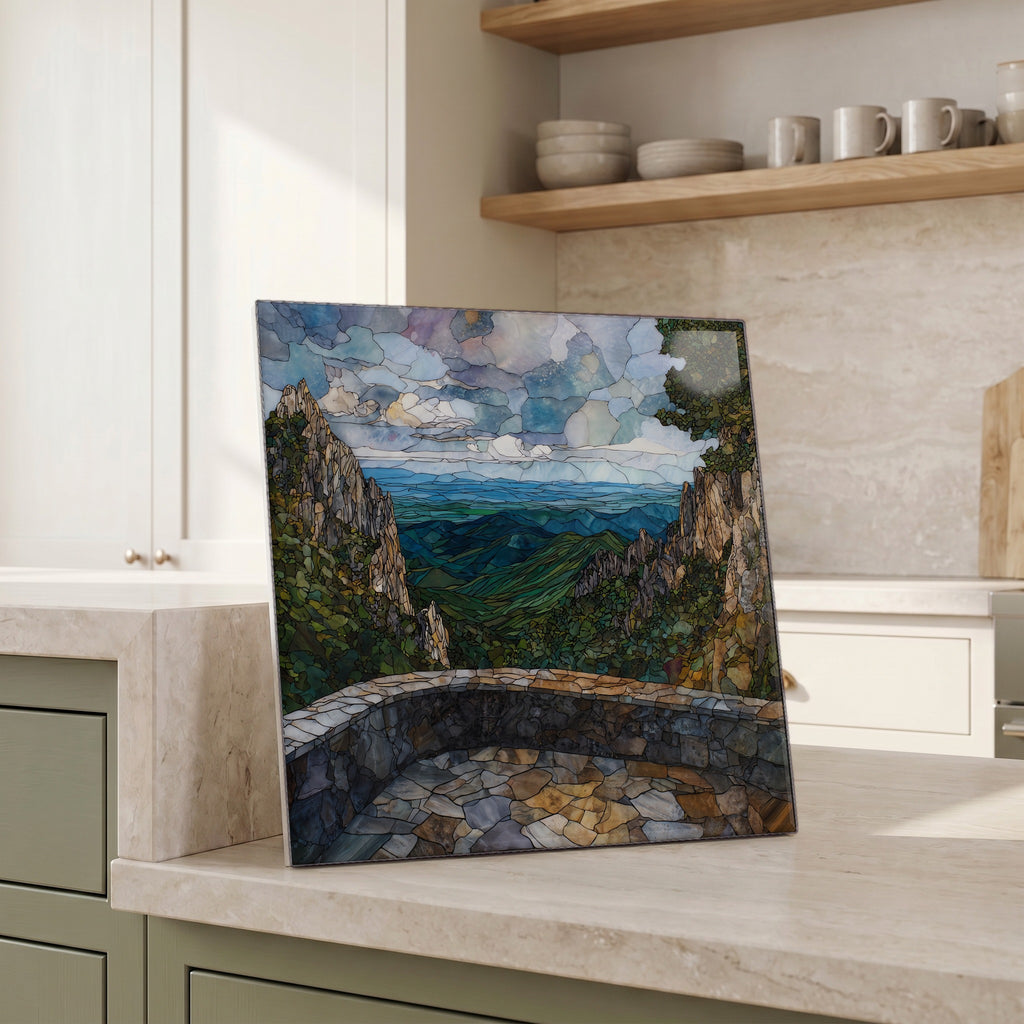 Beside the kettle, propped on the counter.