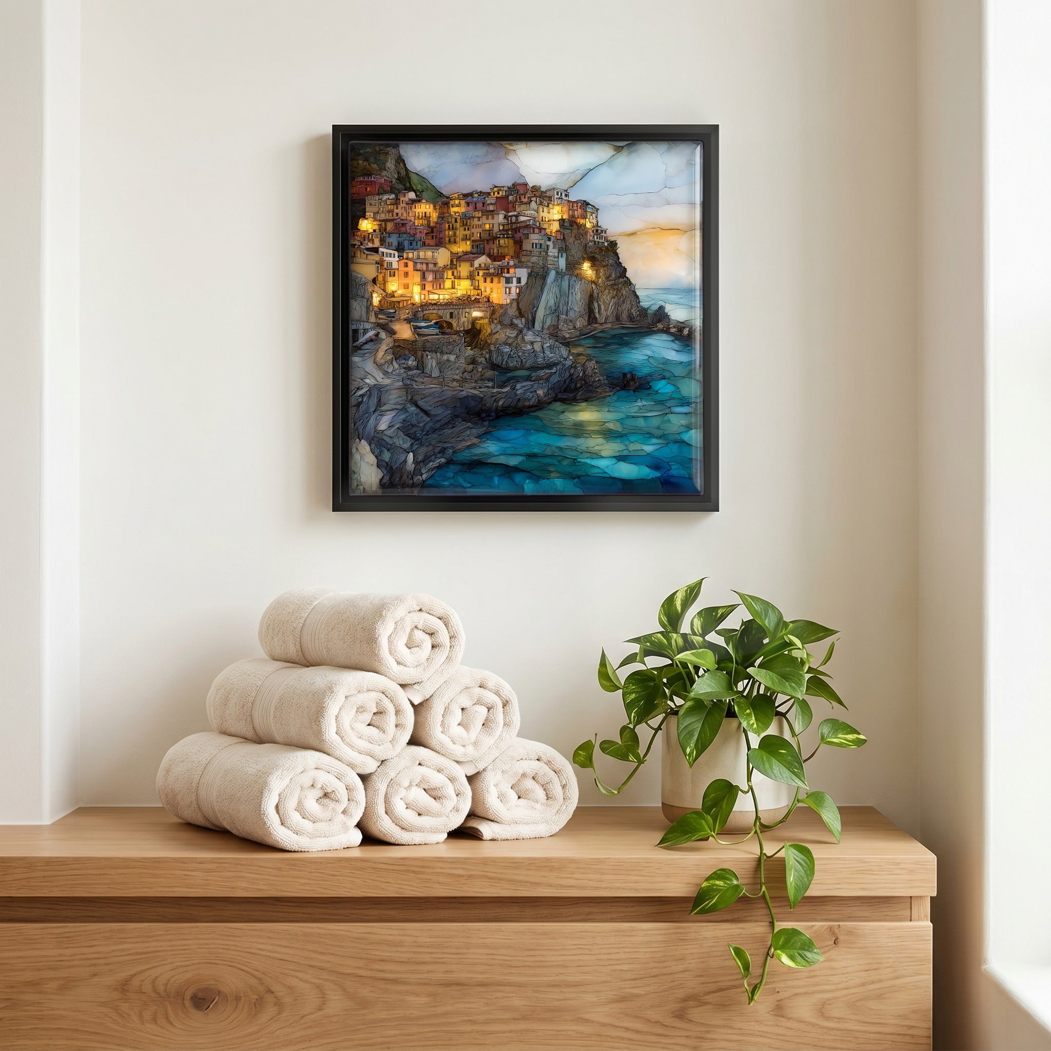 Above the linens, in a slim black surround.