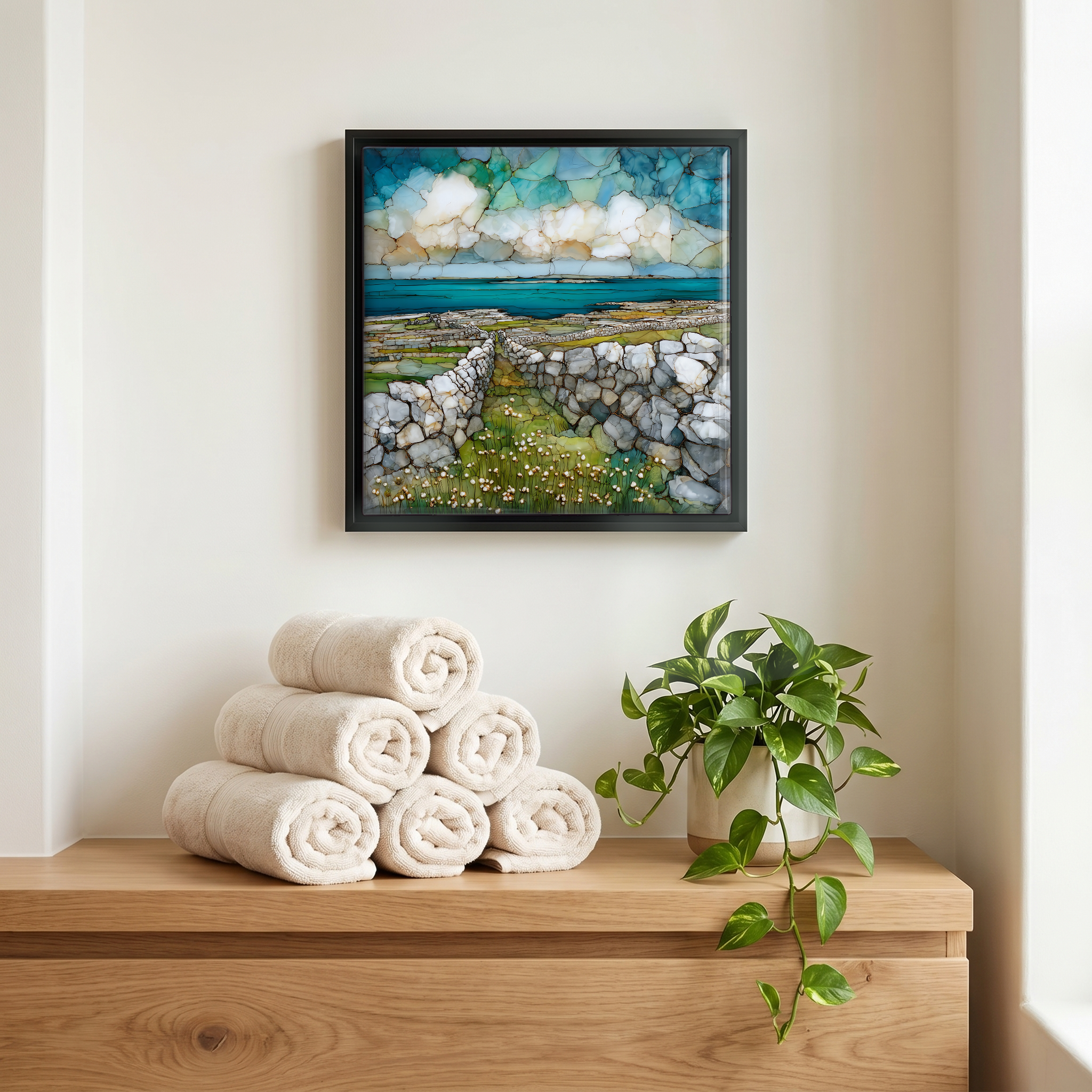 Above the linens, in a slim black surround.