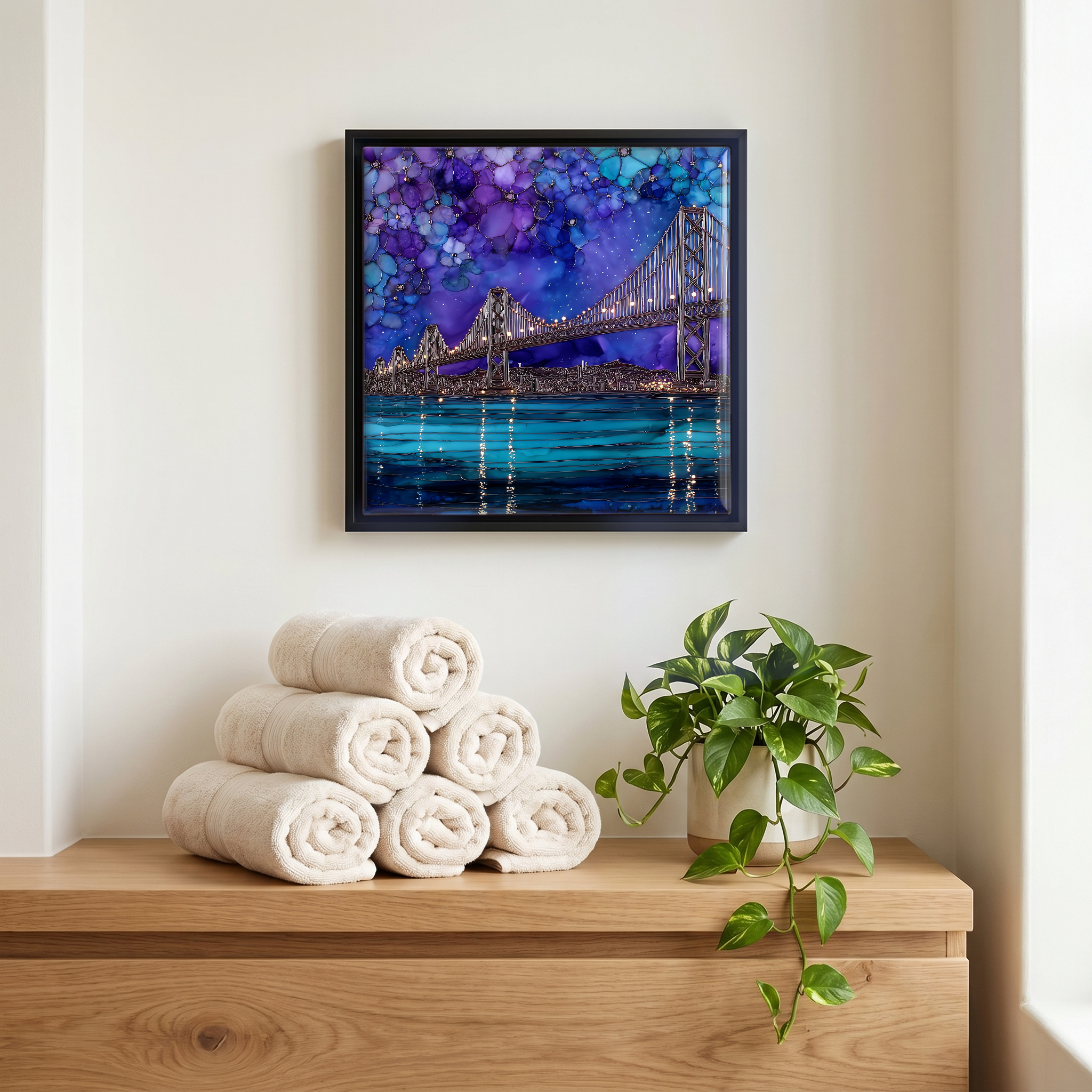 Above the linens, in a slim black surround.