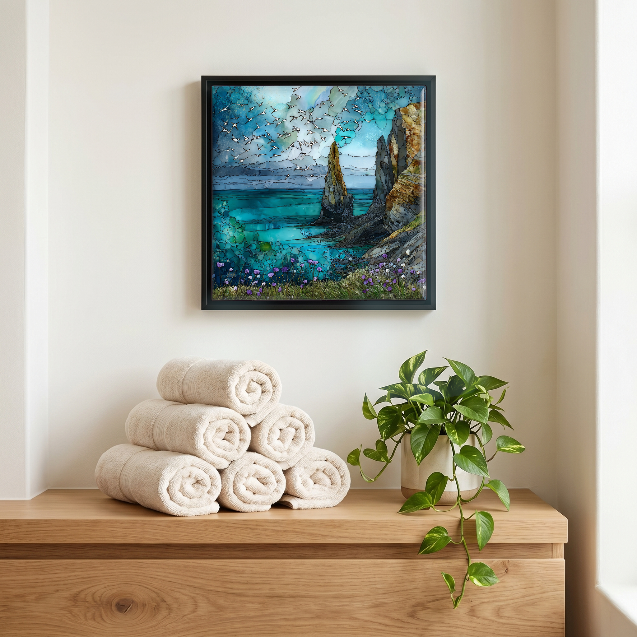 Above the linens, in a slim black surround.
