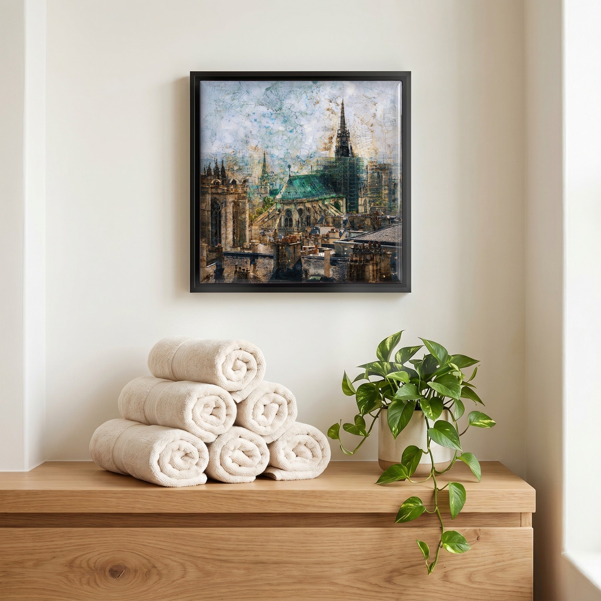 Above the linens, in a slim black surround.