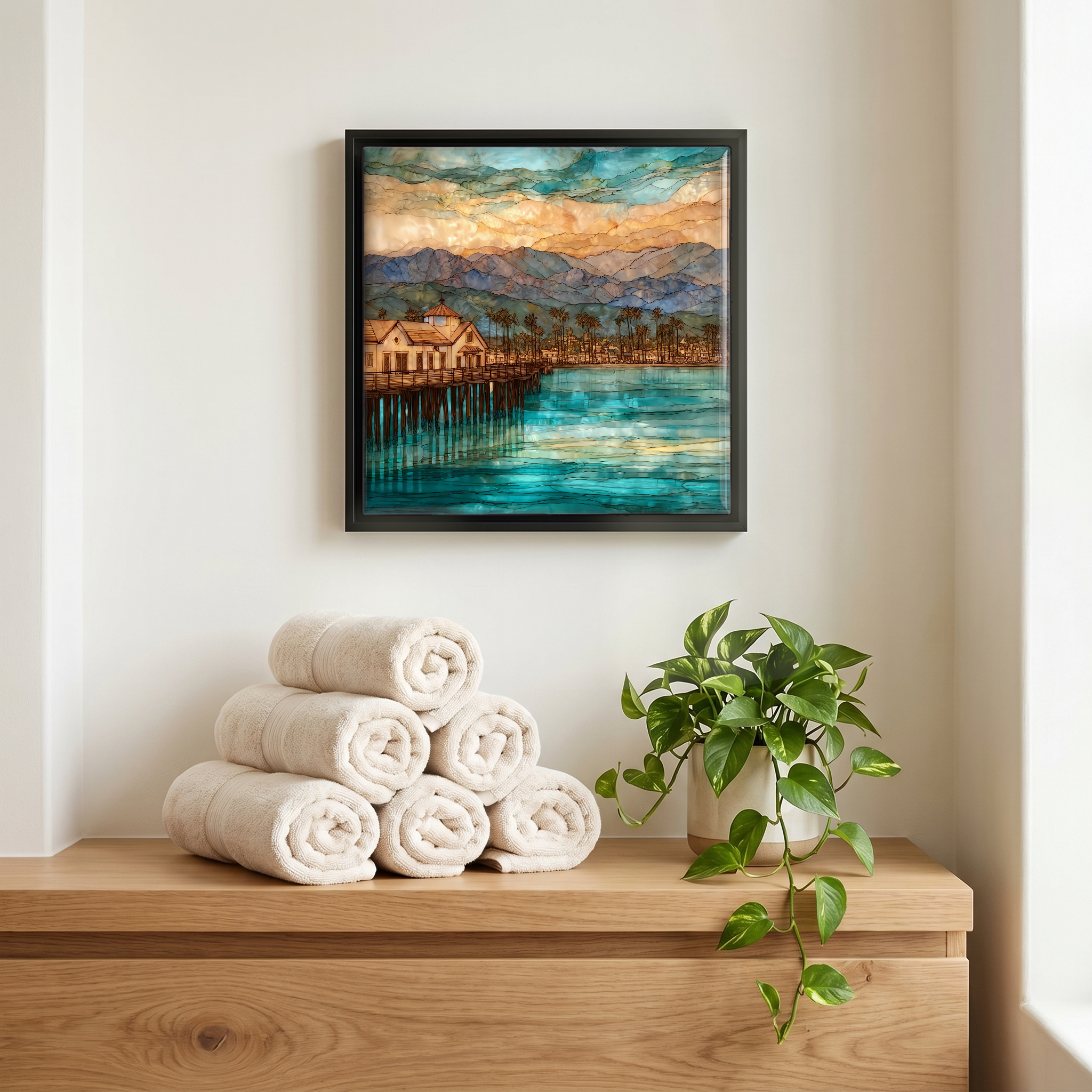 Above the linens, in a slim black surround.