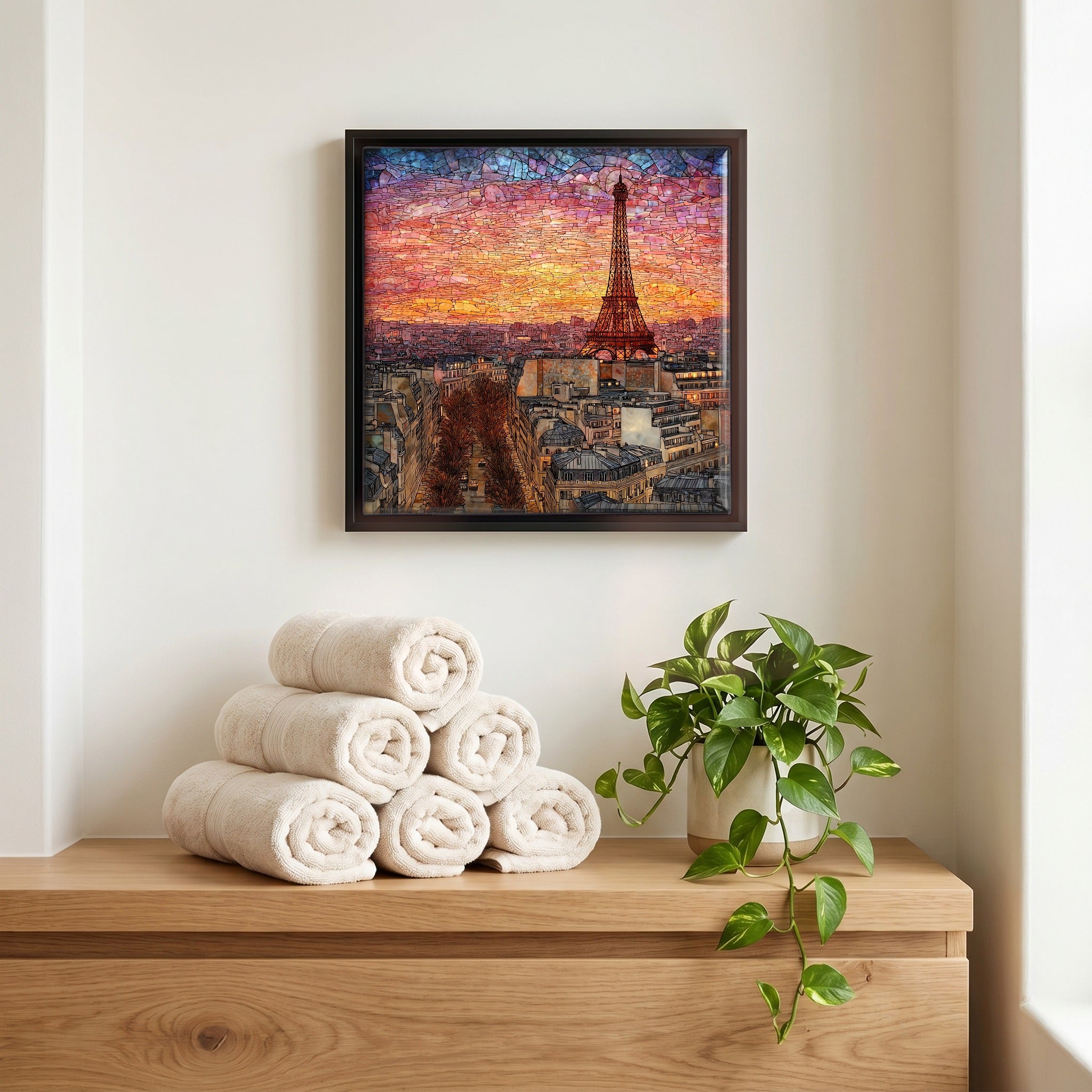 Above the linens, in a slim black surround.