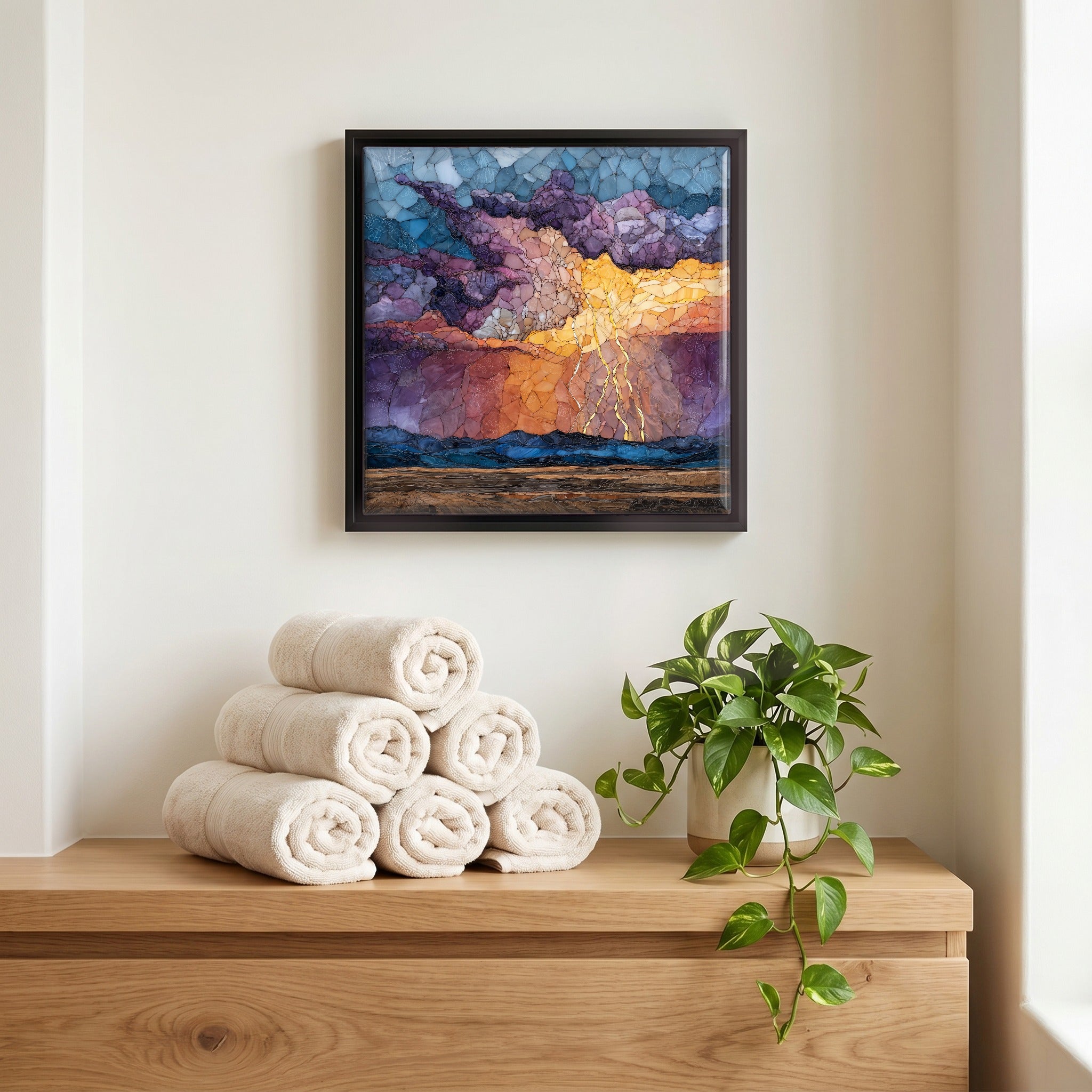 Above the linens, in a slim black surround.