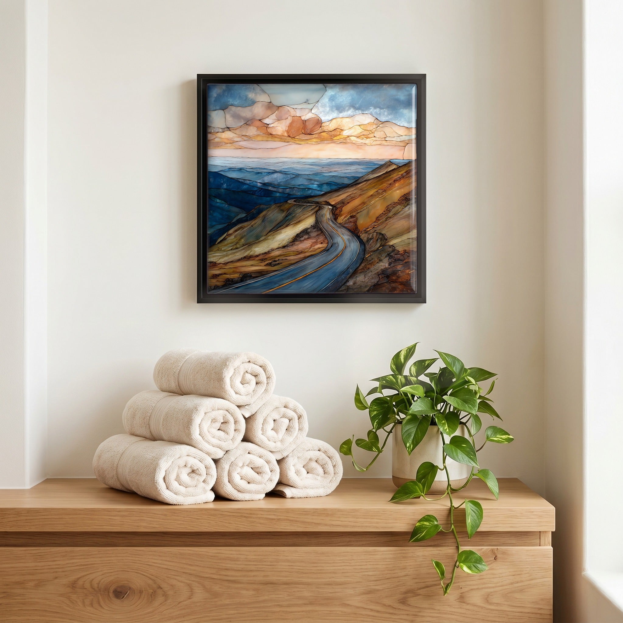 Above the linens, in a slim black surround.