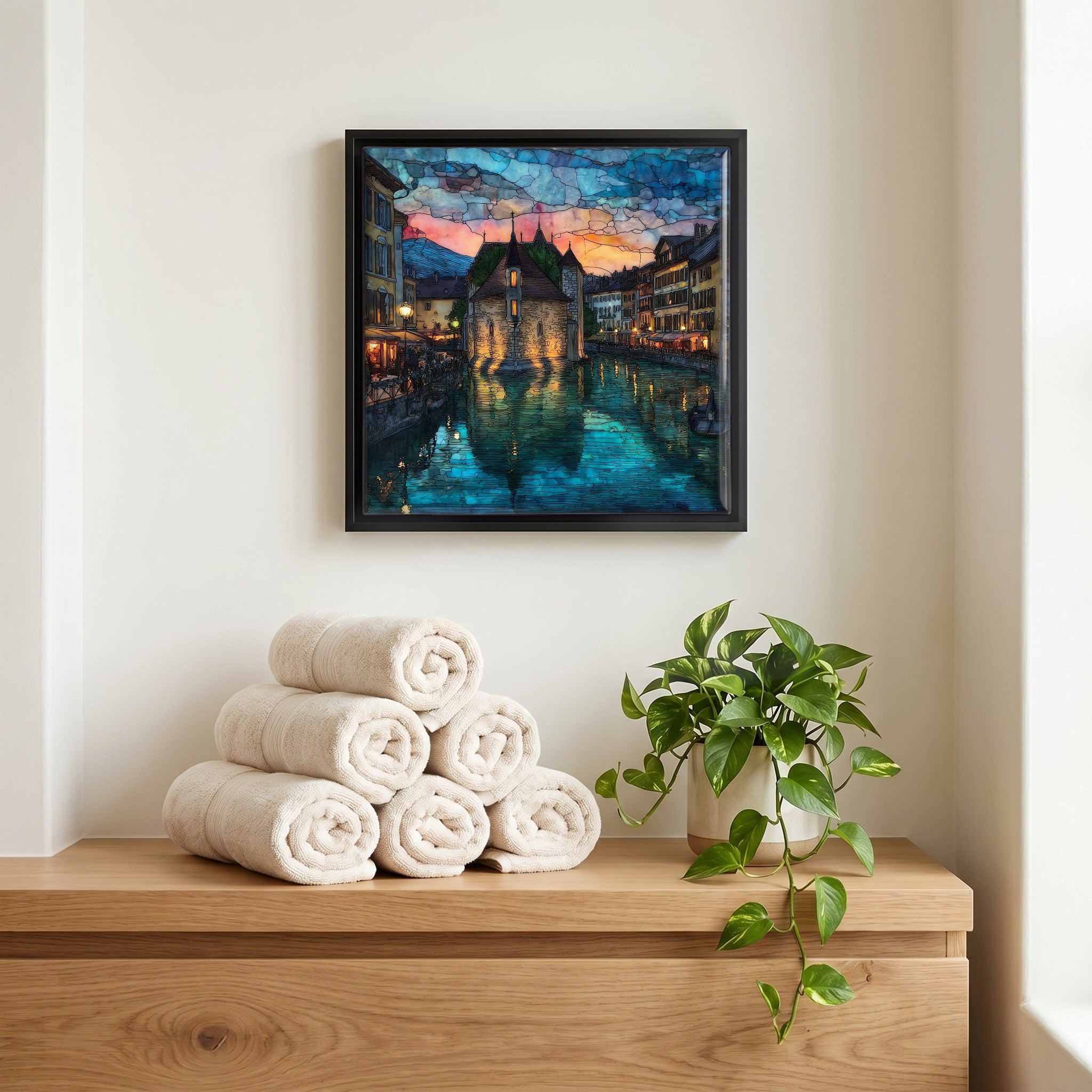 Above the linens, in a slim black surround.