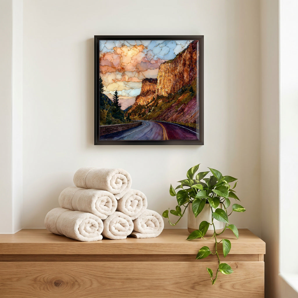 Above the linens, in a slim black surround.