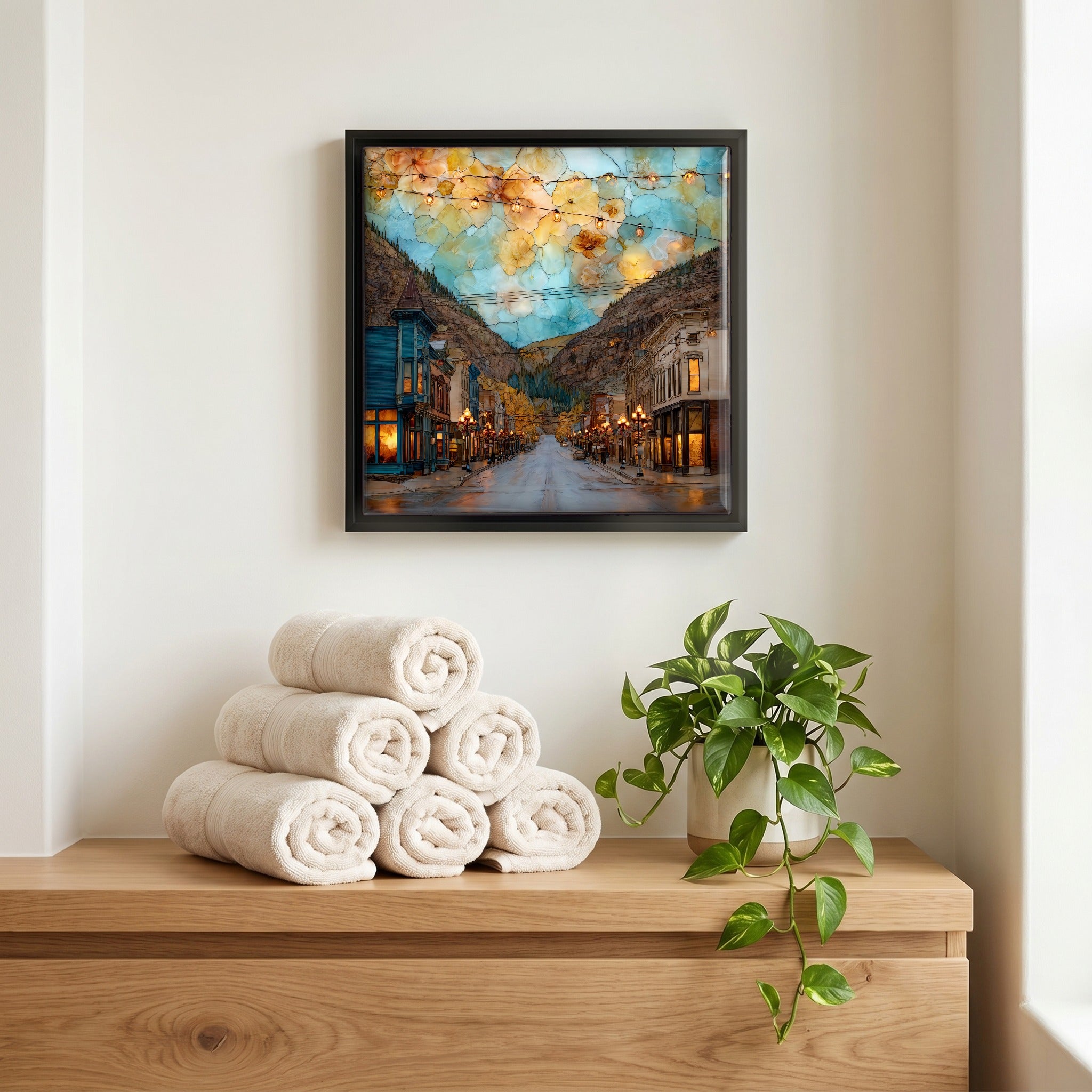 Above the linens, in a slim black surround.