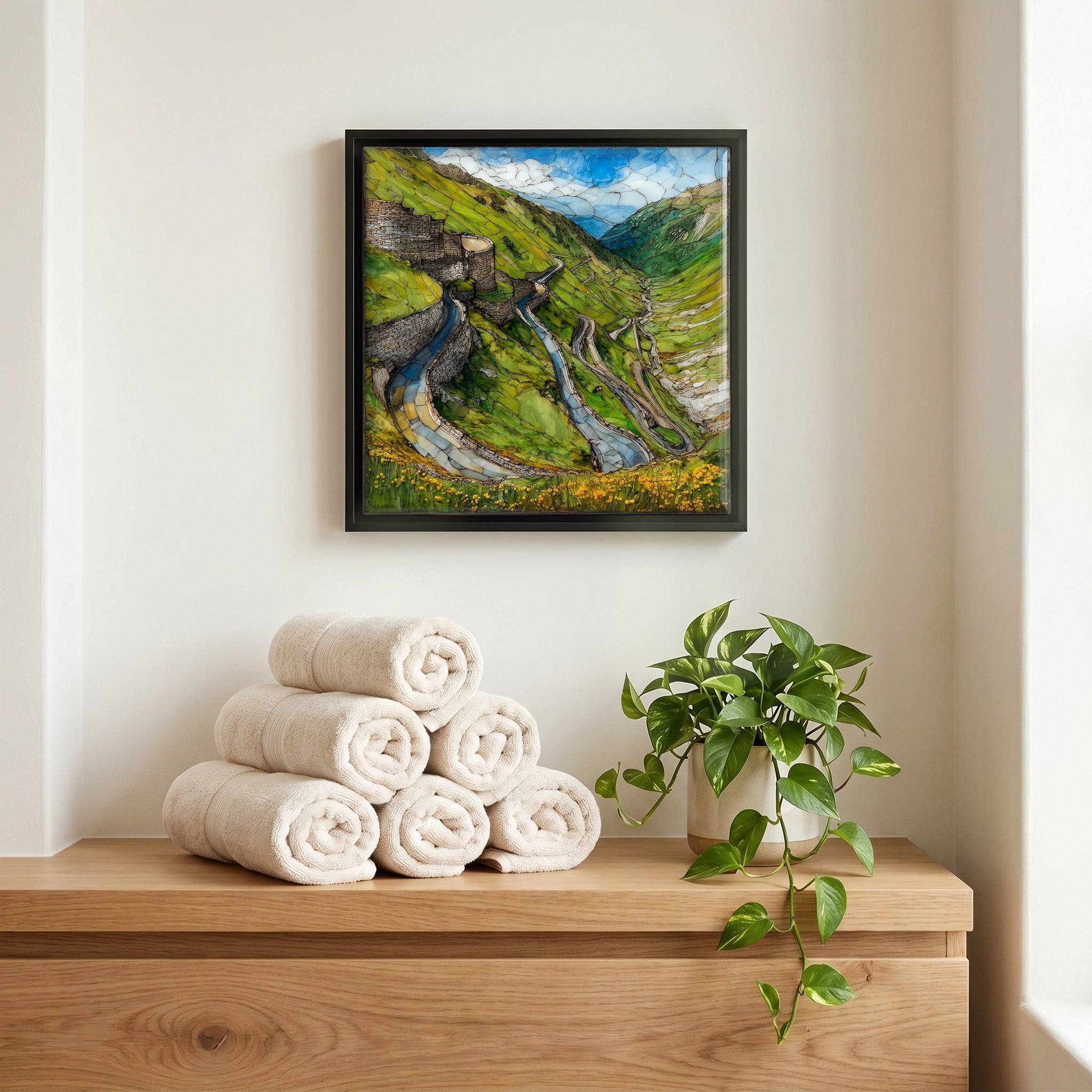 Above the linens, in a slim black surround.