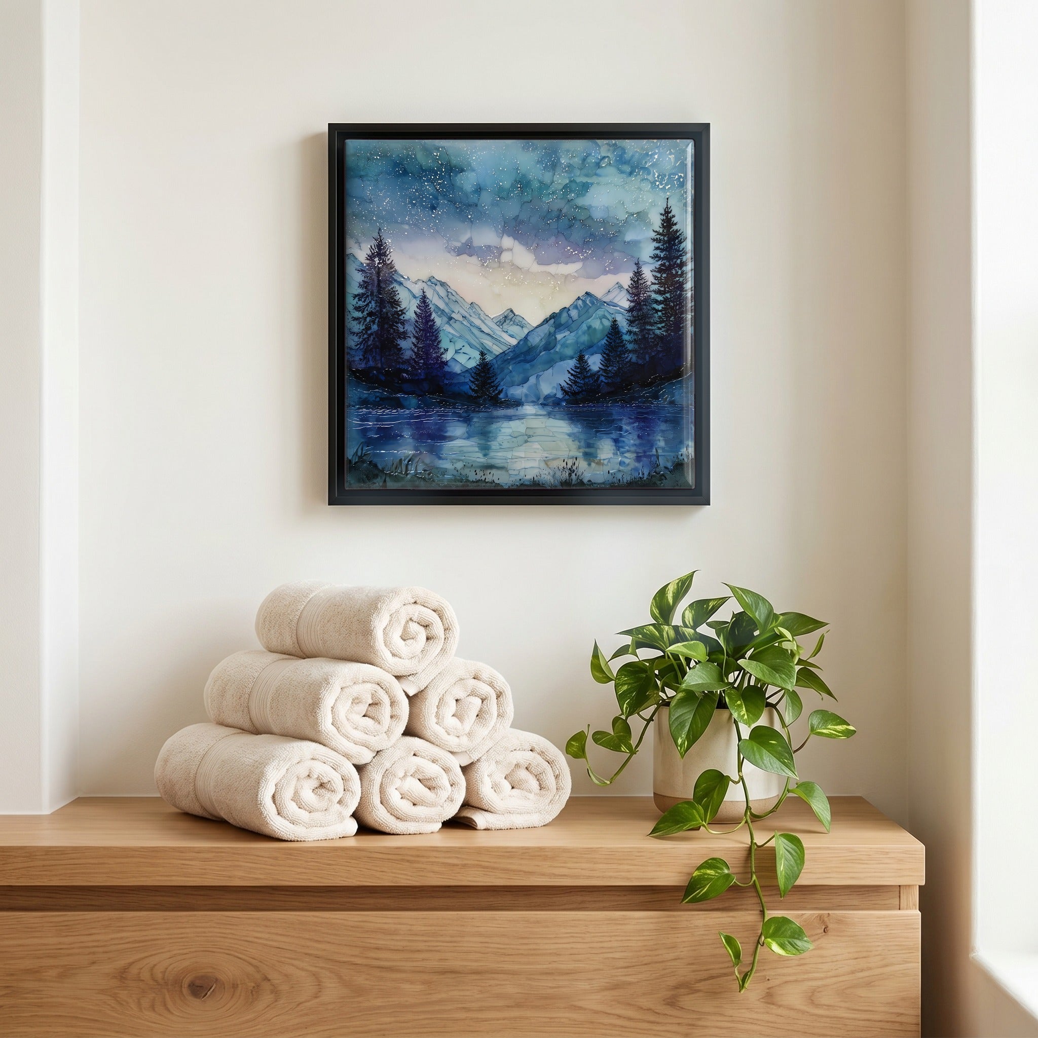 Above the linens, in a slim black surround.