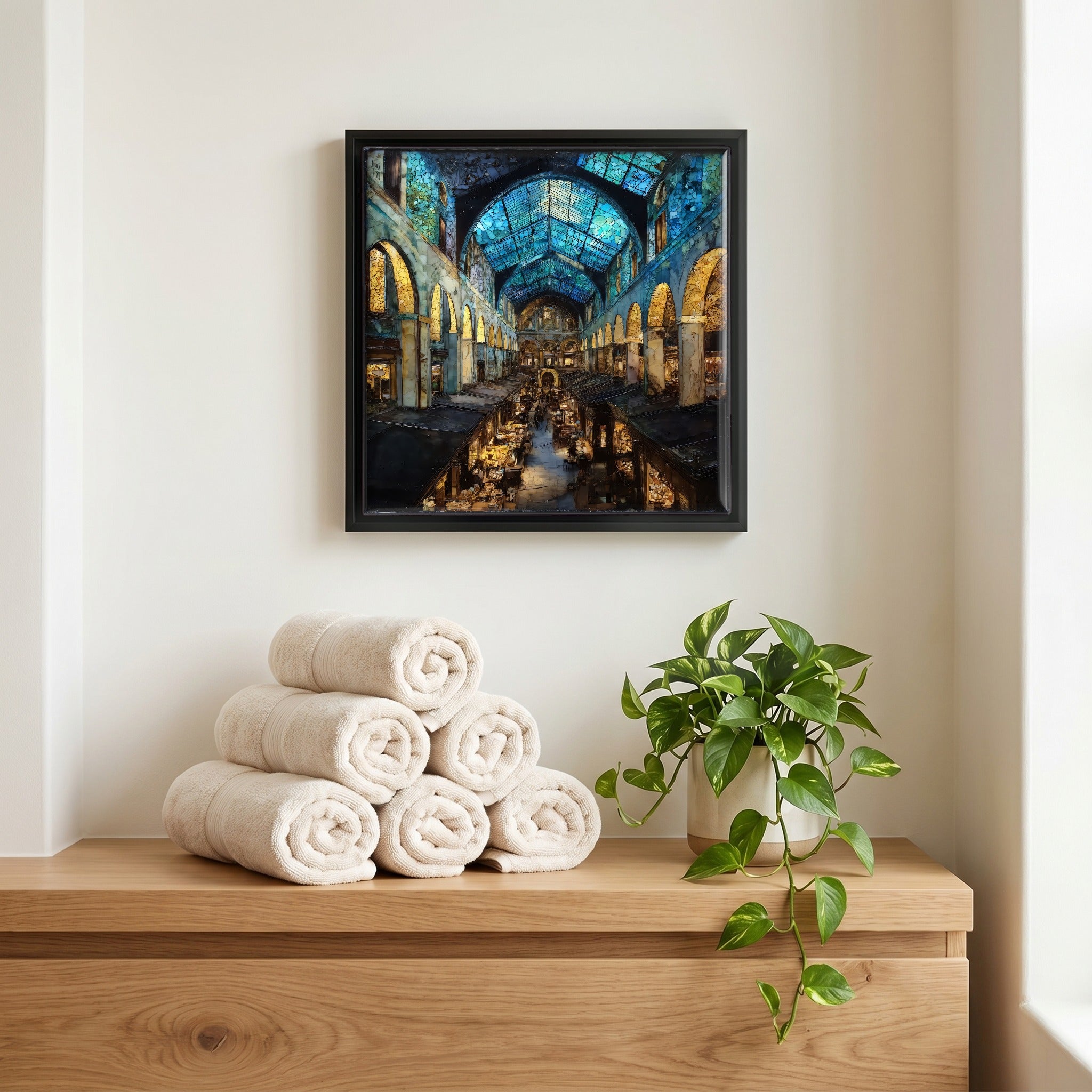 Above the linens, in a slim black surround.