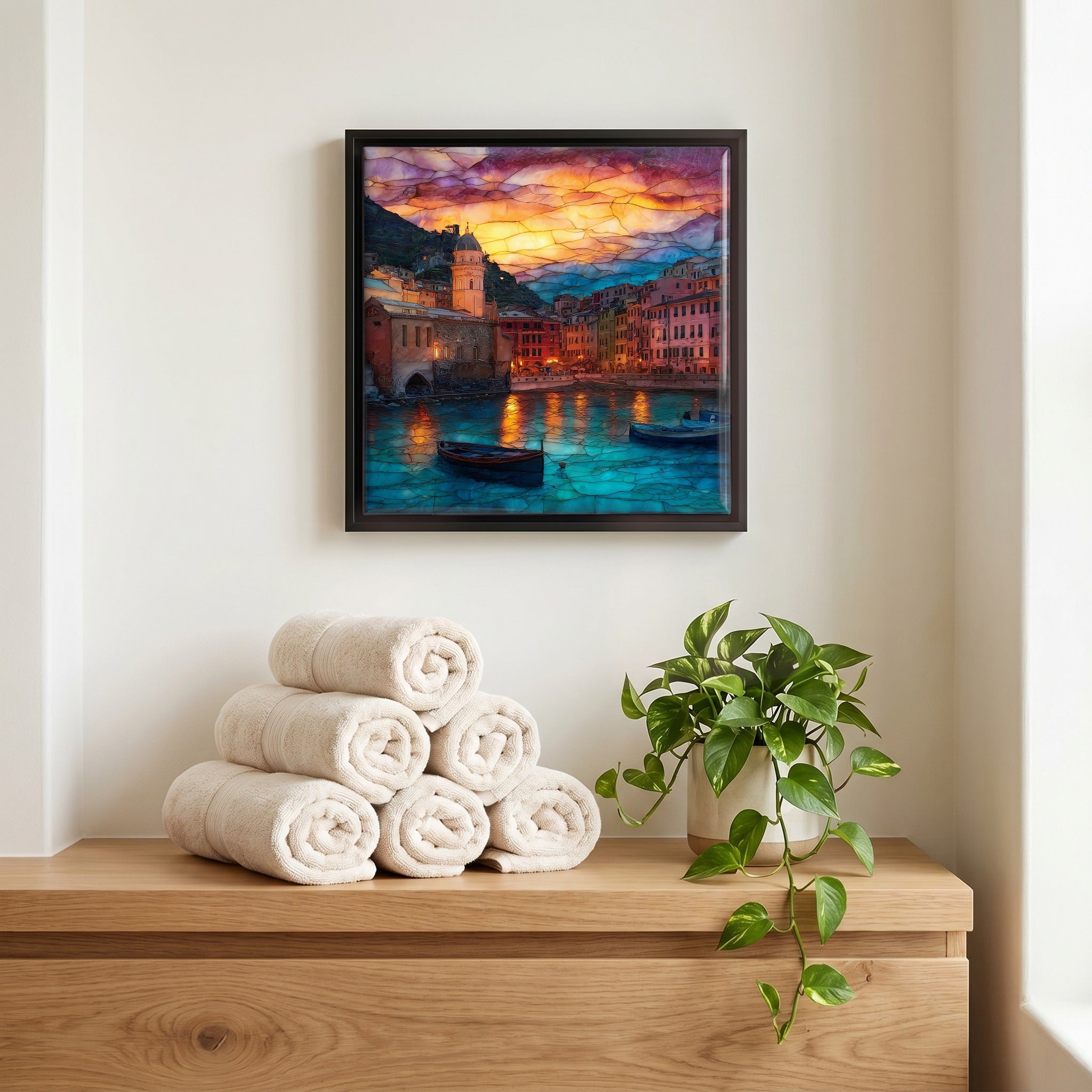 Above the linens, in a slim black surround.