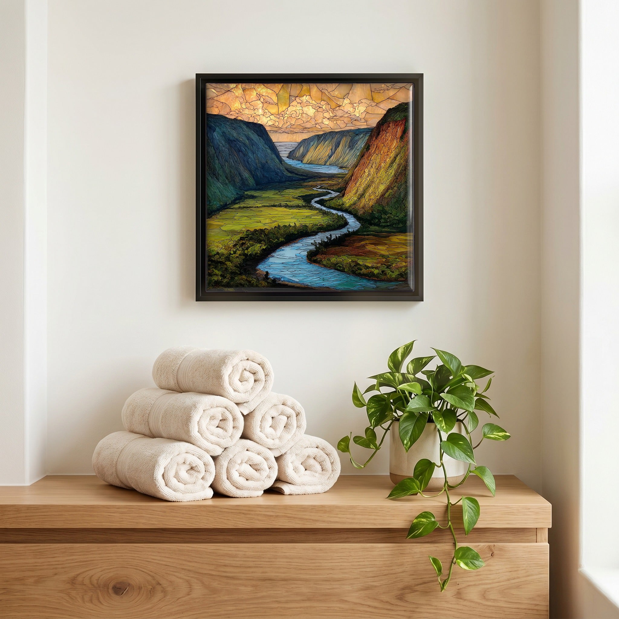Above the linens, in a slim black surround.