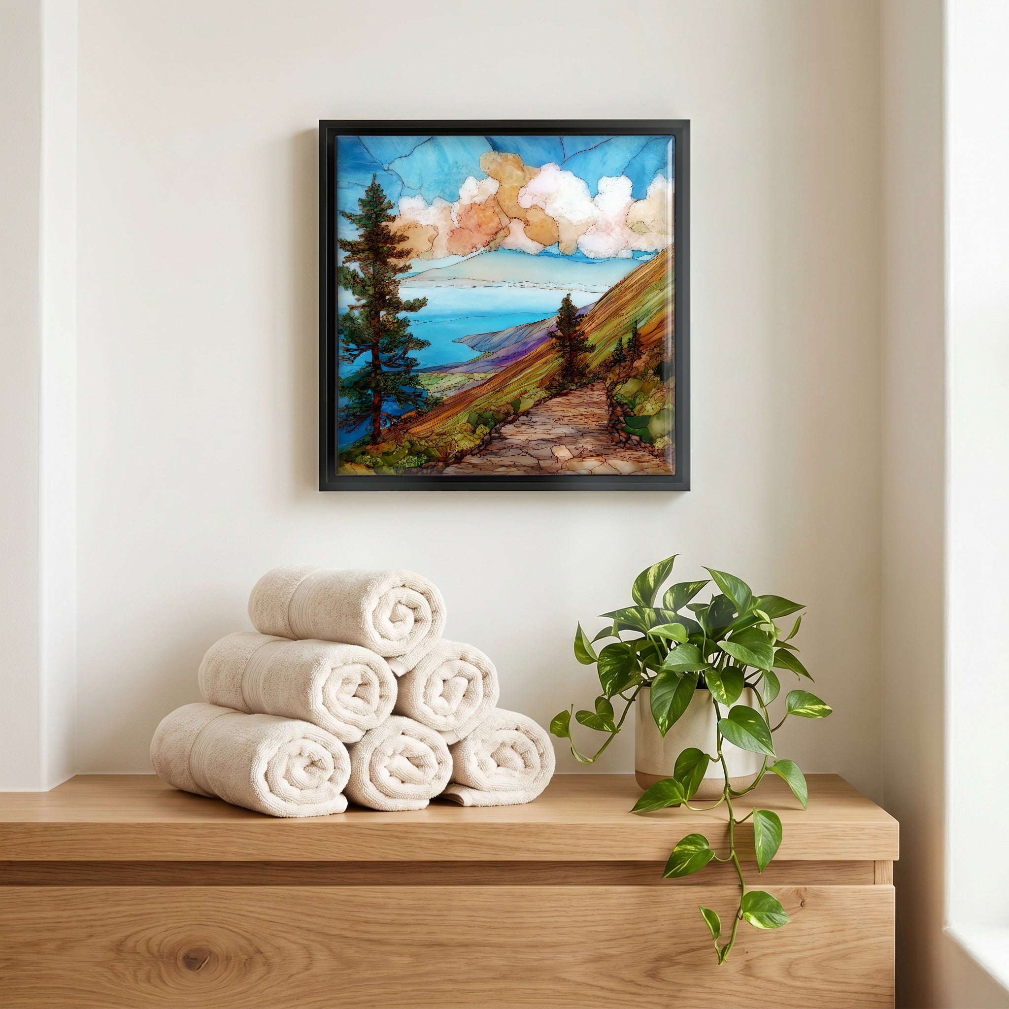 Above the linens, in a slim black surround.