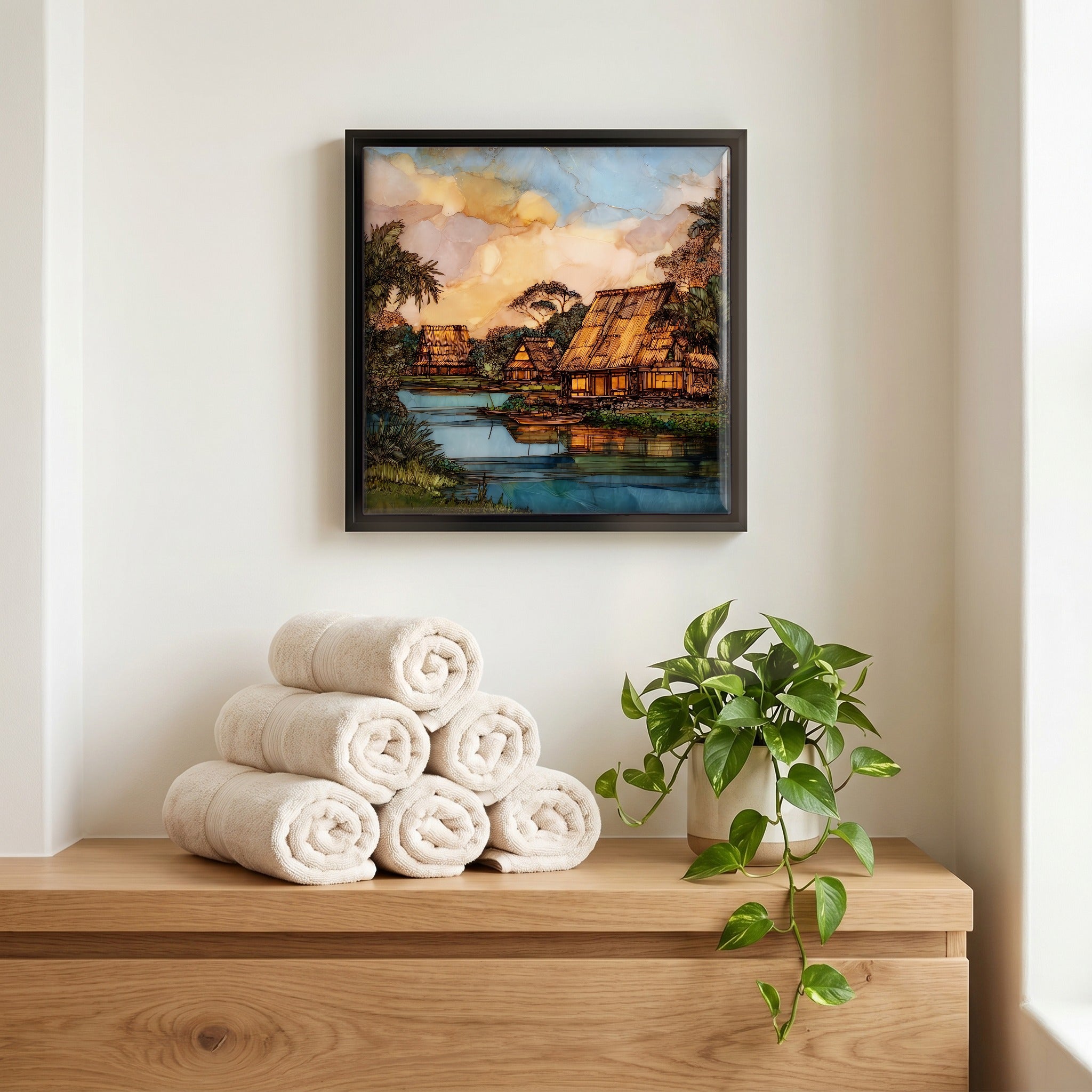 Above the linens, in a slim black surround.