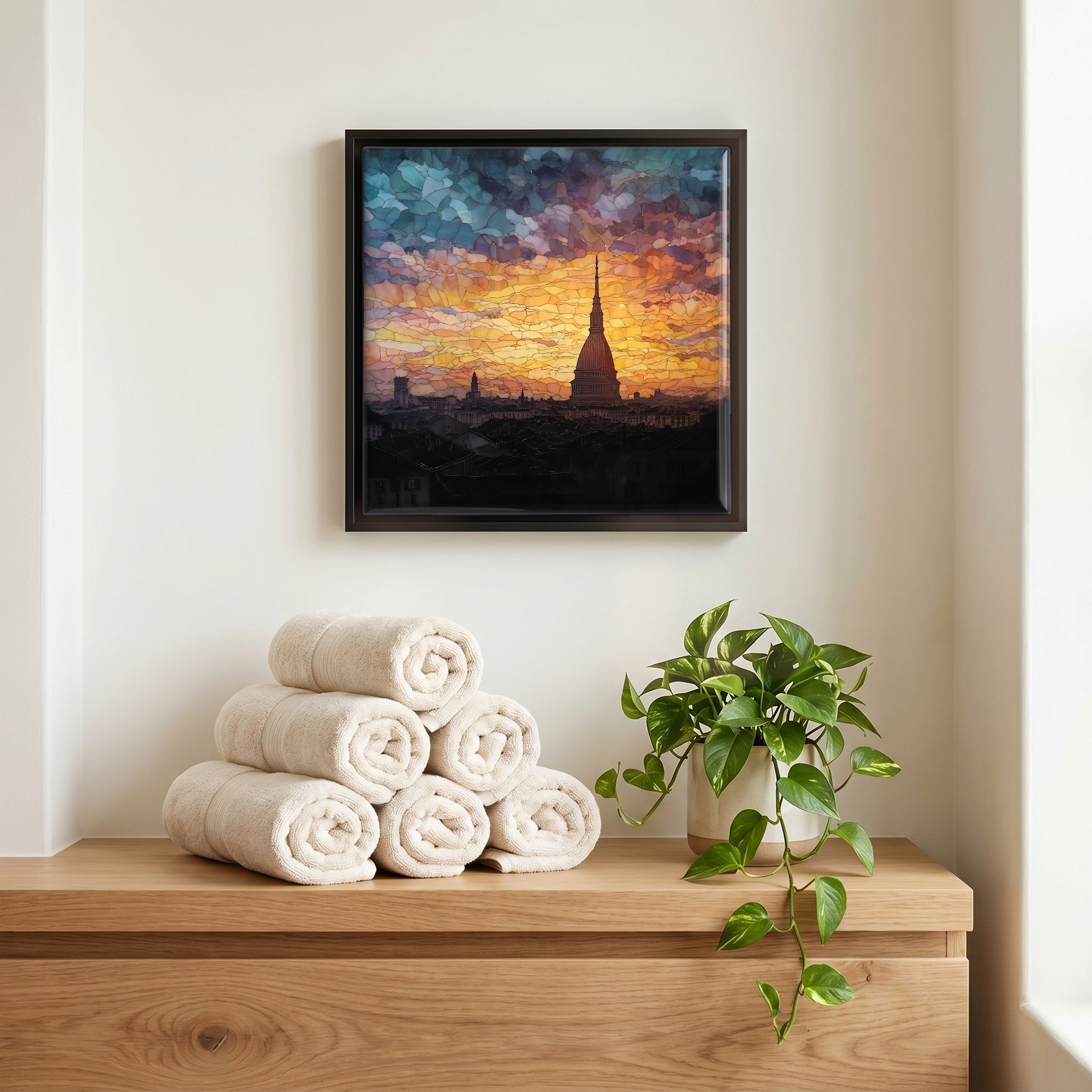 Above the linens, in a slim black surround.
