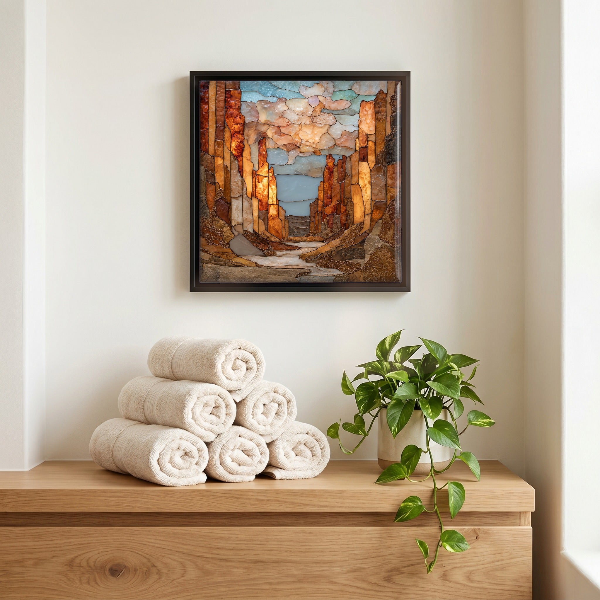 Above the linens, in a slim black surround.