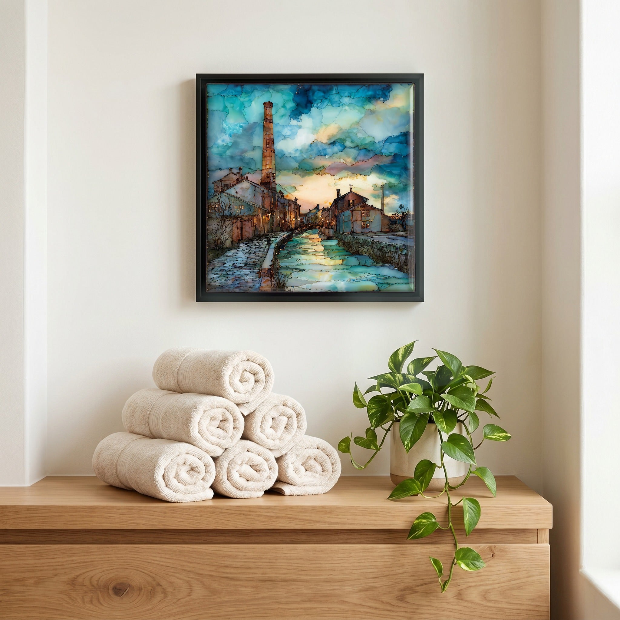 Above the linens, in a slim black surround.