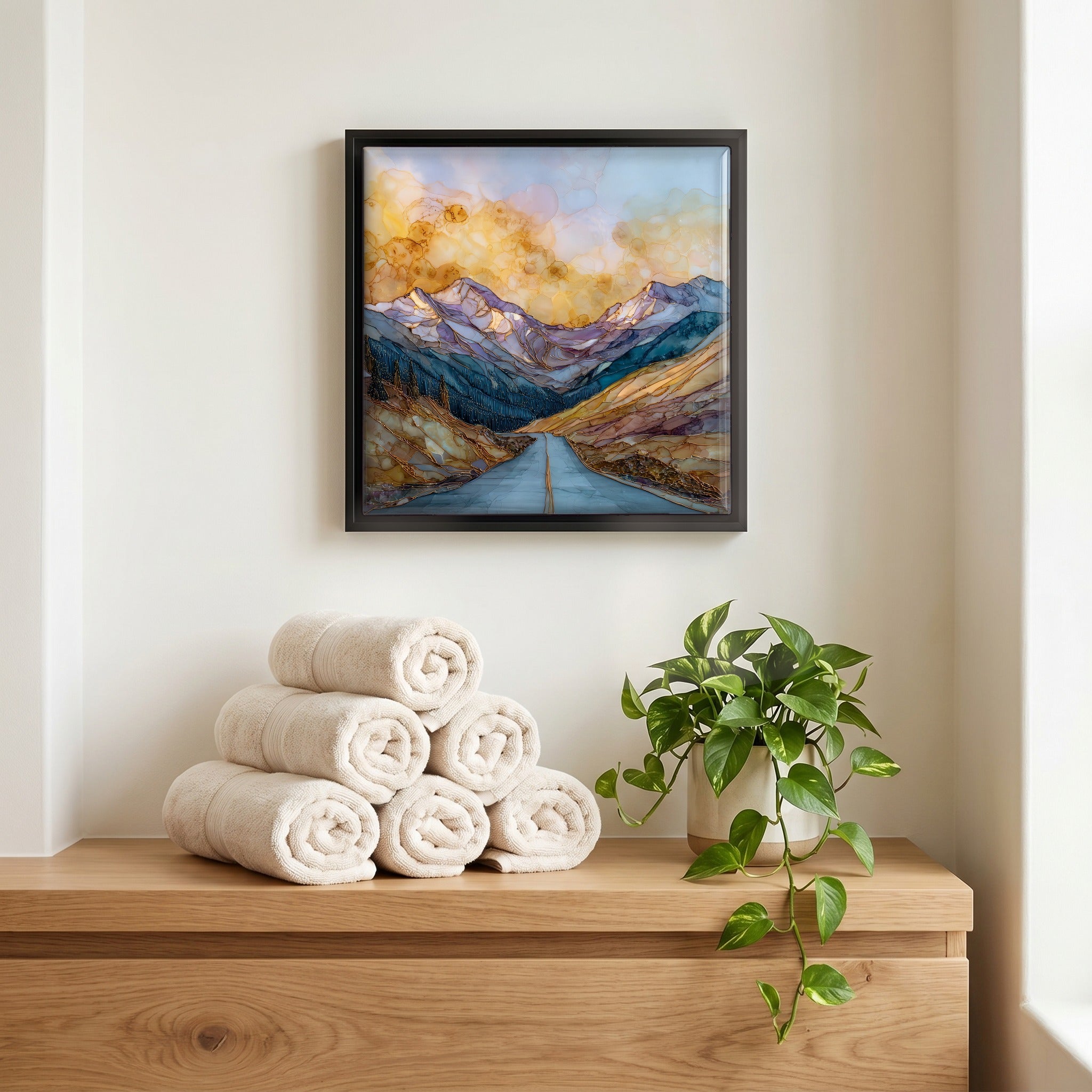 Above the linens, in a slim black surround.