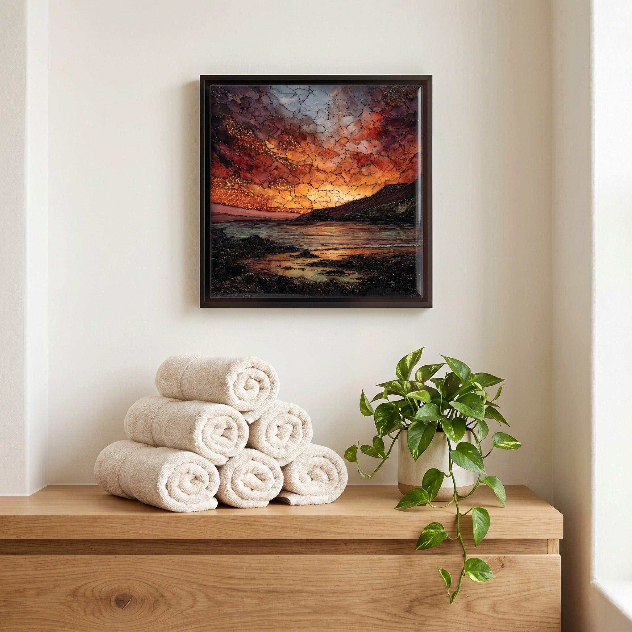 Above the linens, in a slim black surround.