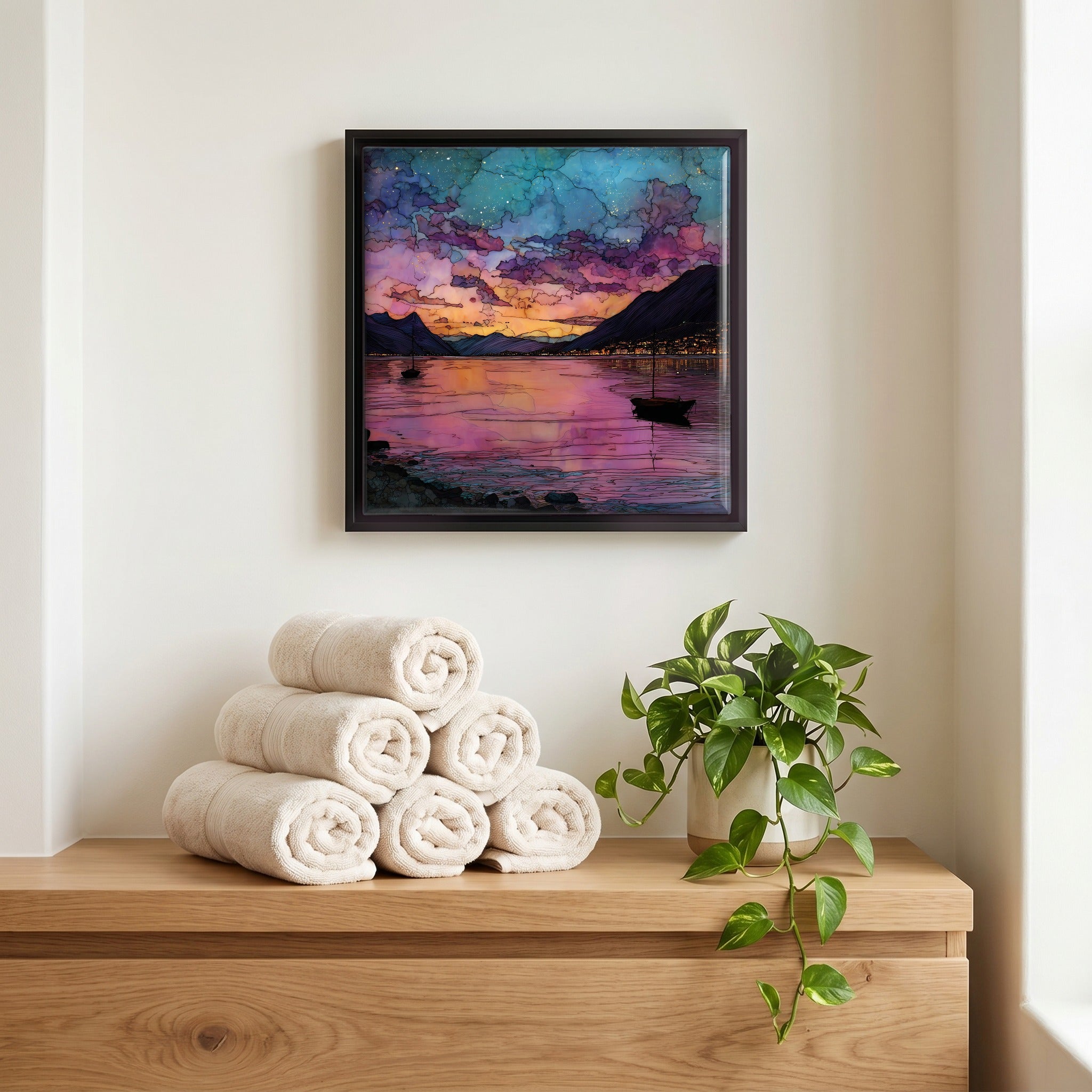 Above the linens, in a slim black surround.