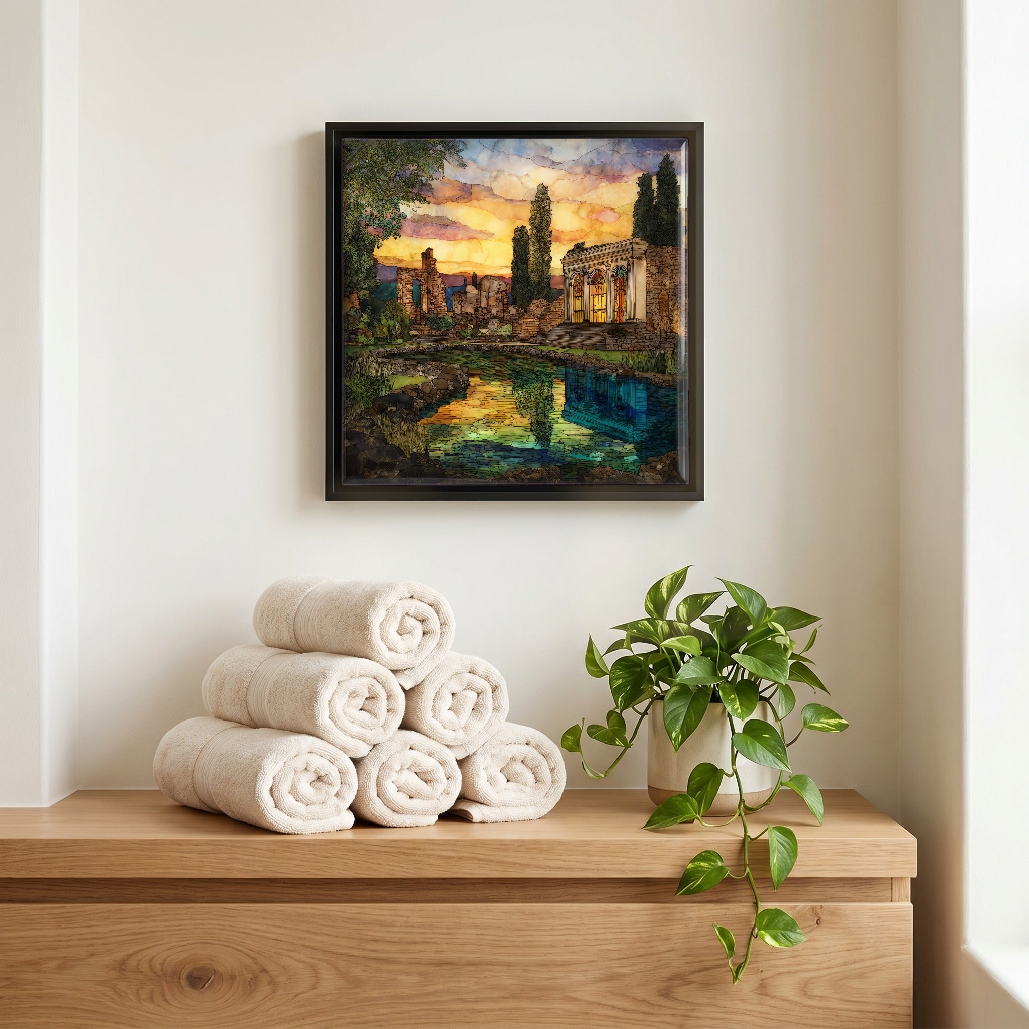 Above the linens, in a slim black surround.
