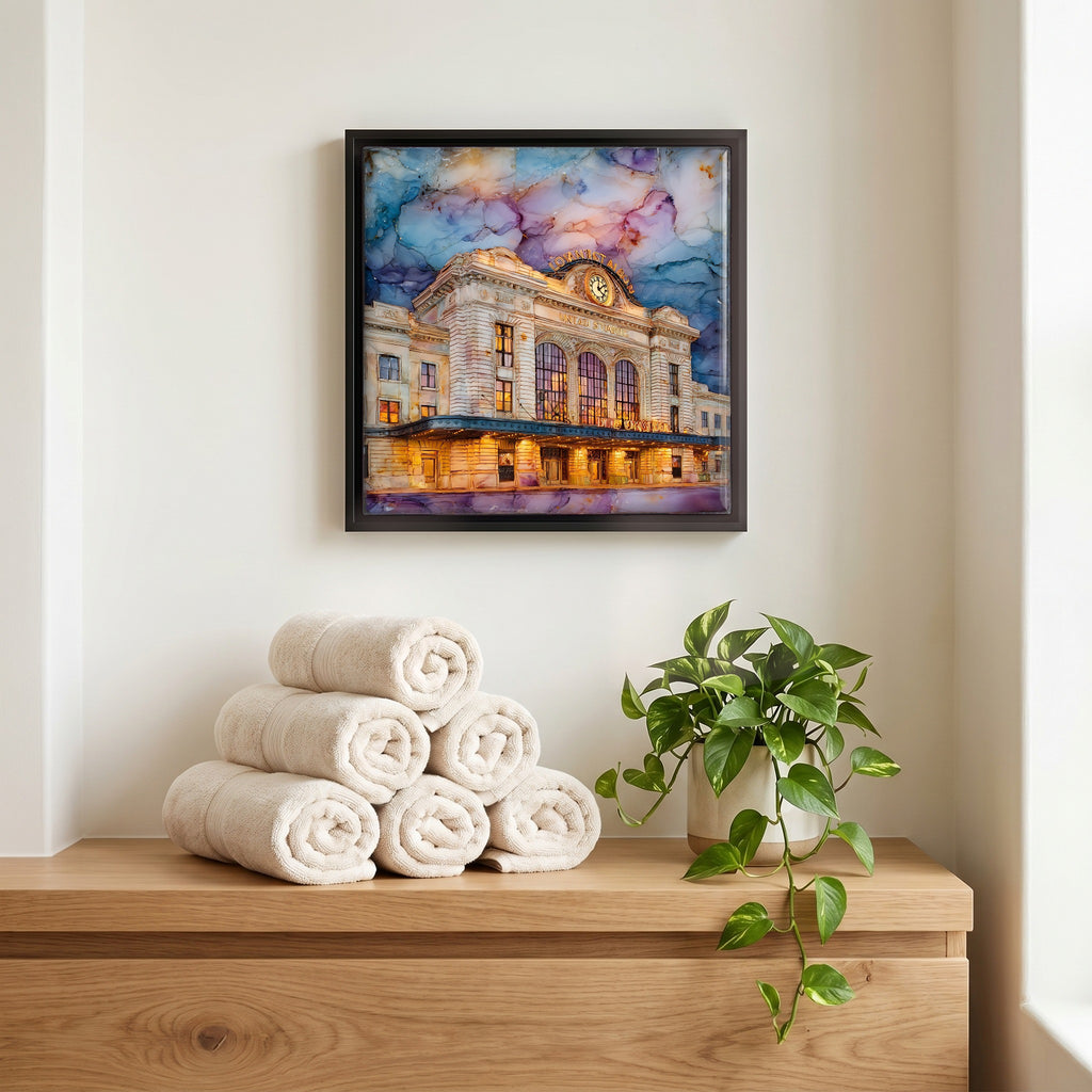 Above the linens, in a slim black surround.