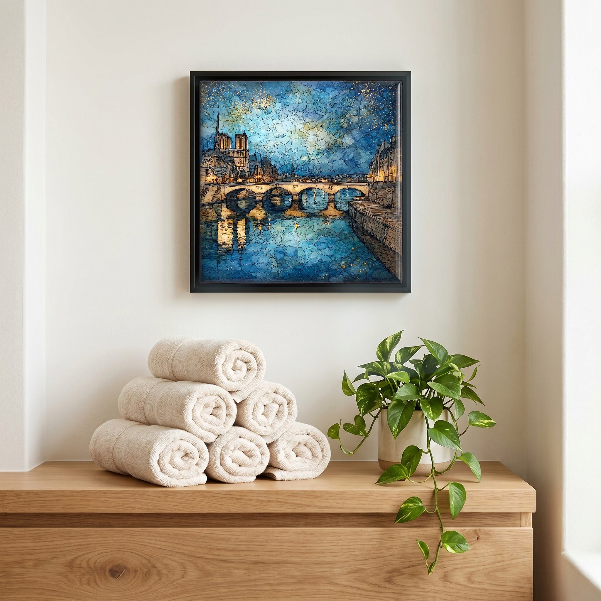 Above the linens, in a slim black surround.