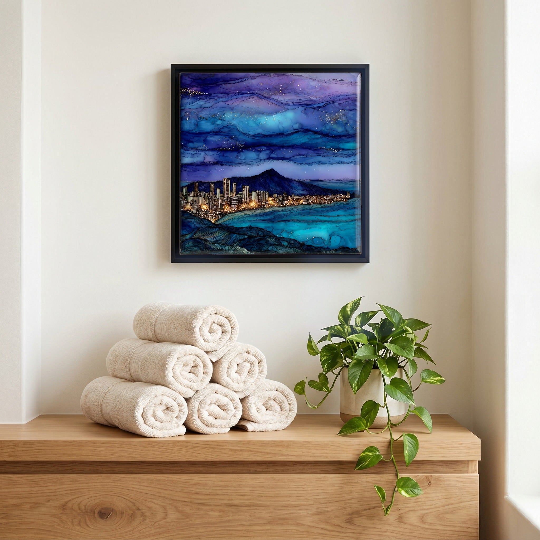 Above the linens, in a slim black surround.