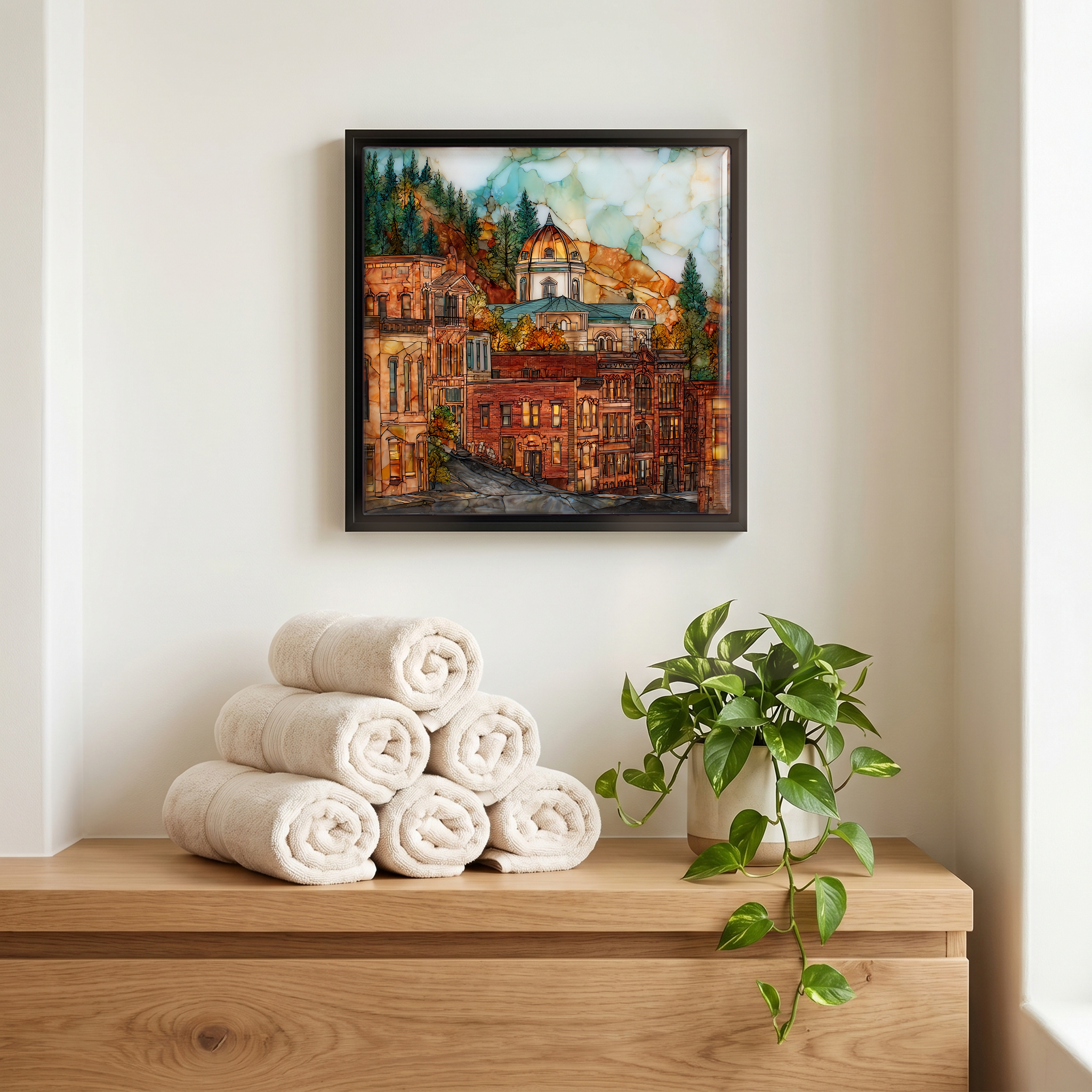 Above the linens, in a slim black surround.