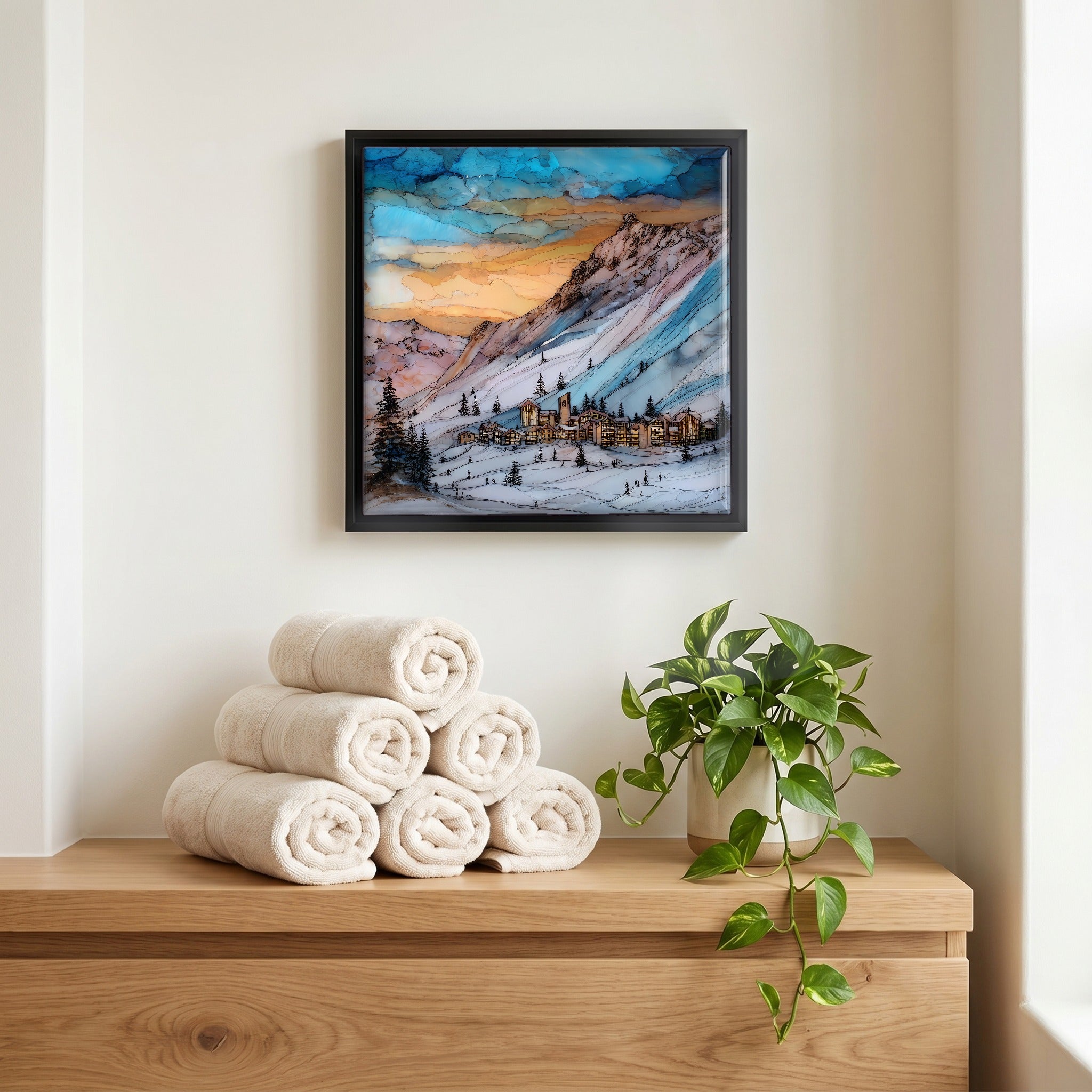 Above the linens, in a slim black surround.