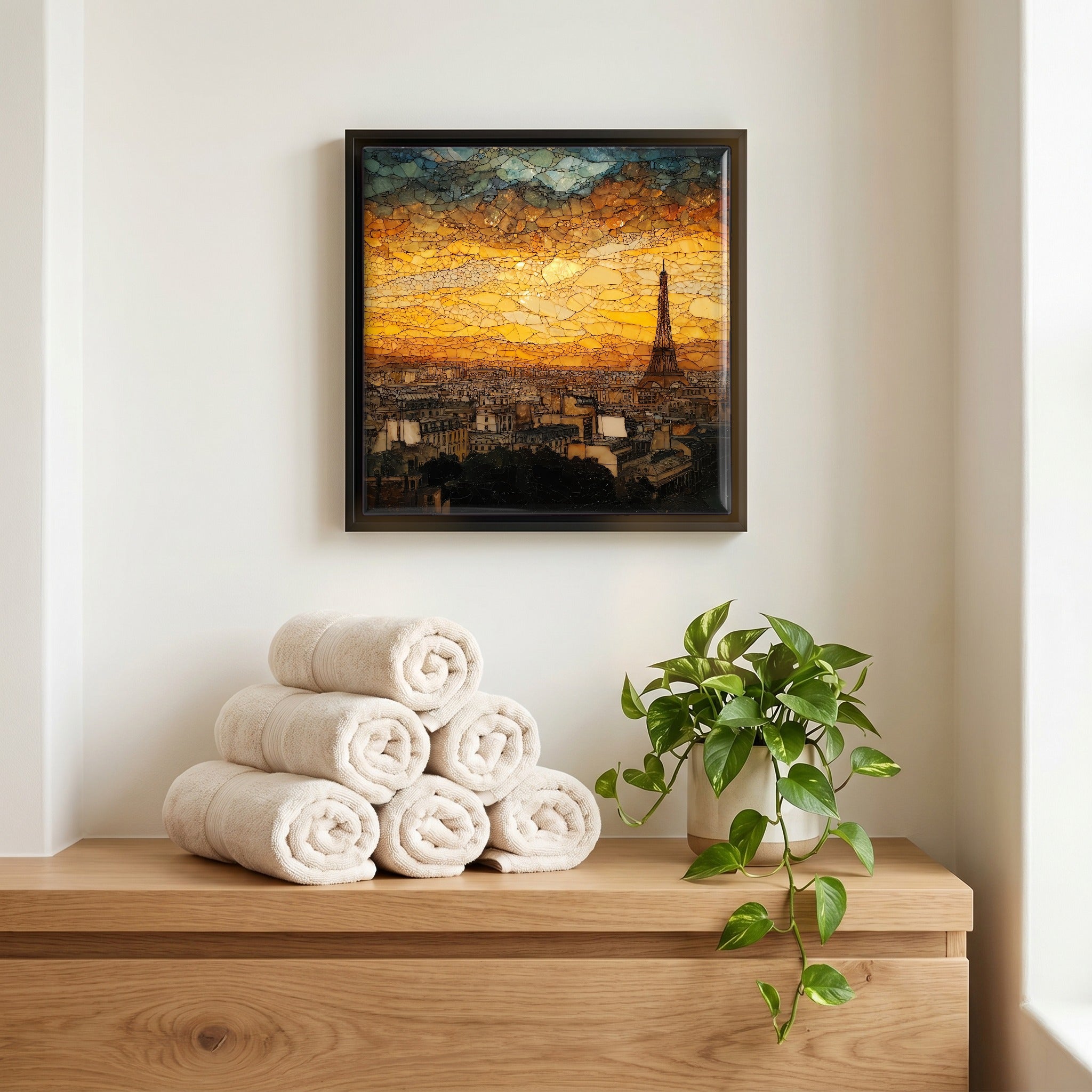 Above the linens, in a slim black surround.