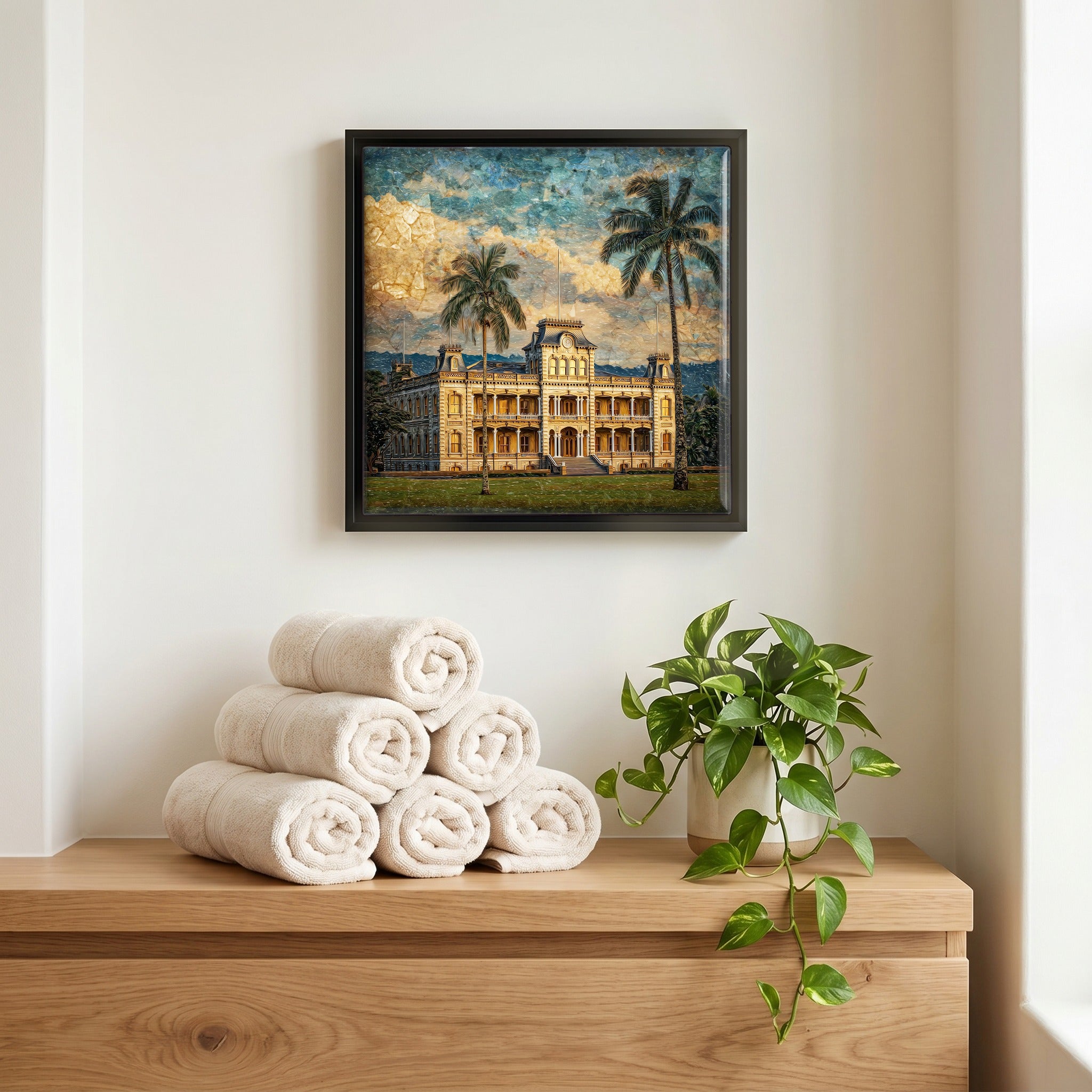 Above the linens, in a slim black surround.