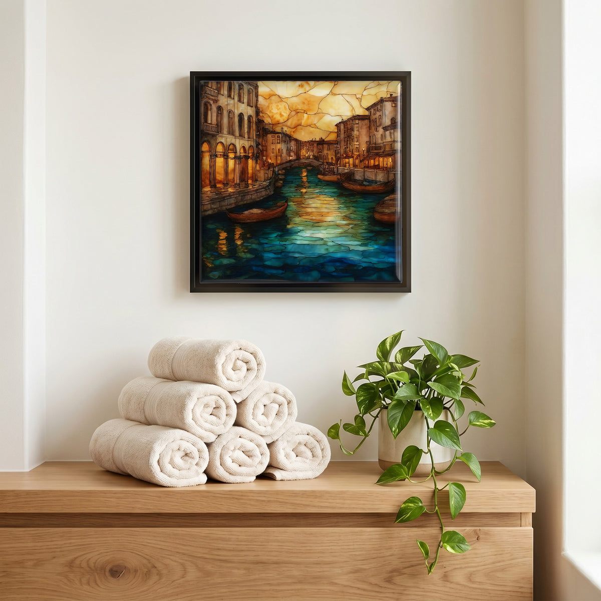 Above the linens, in a slim black surround.