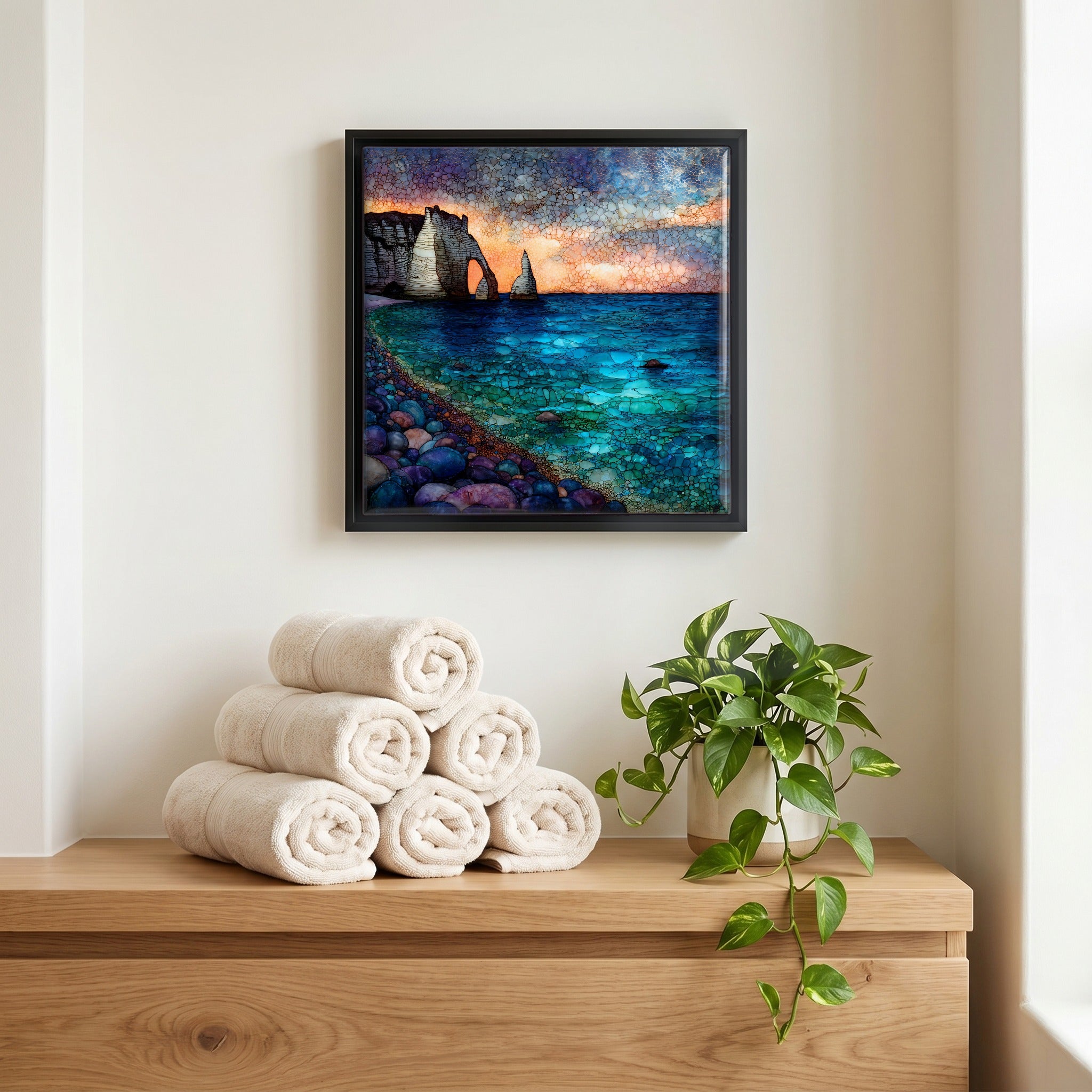 Above the linens, in a slim black surround.