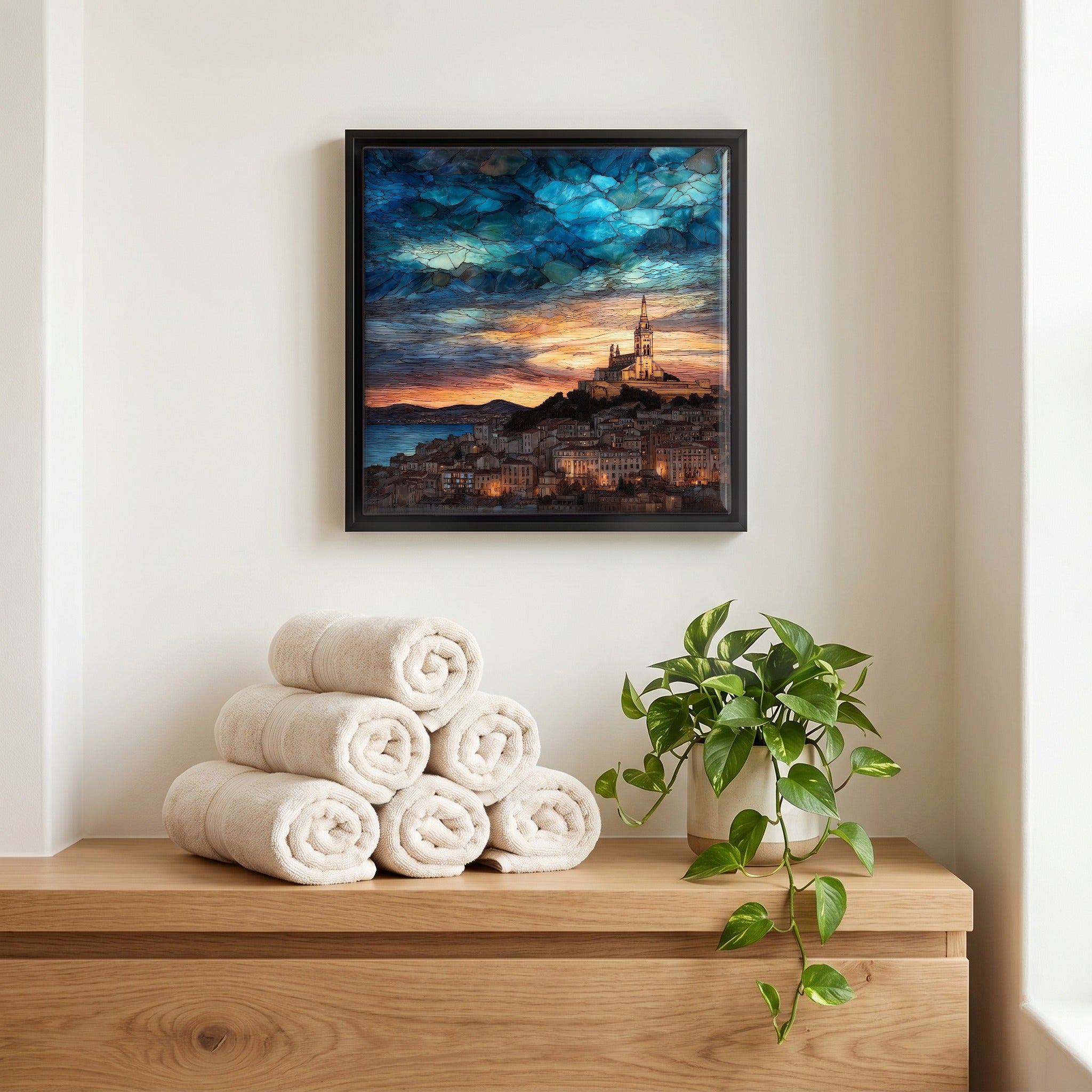 Above the linens, in a slim black surround.