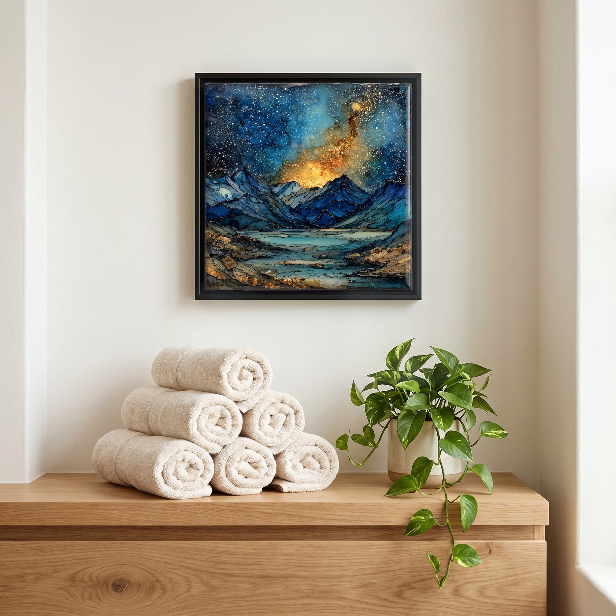 Above the linens, in a slim black surround.
