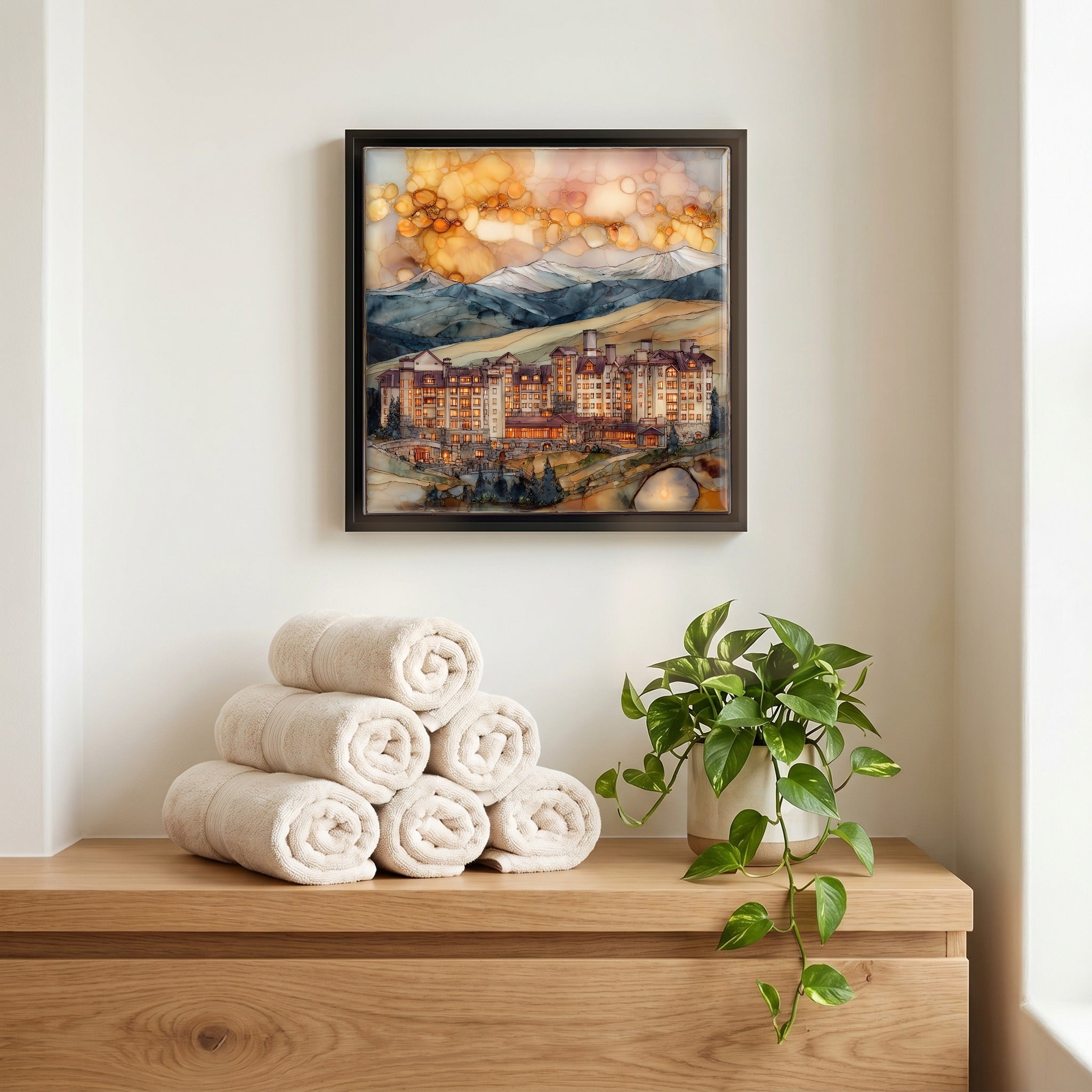 Above the linens, in a slim black surround.