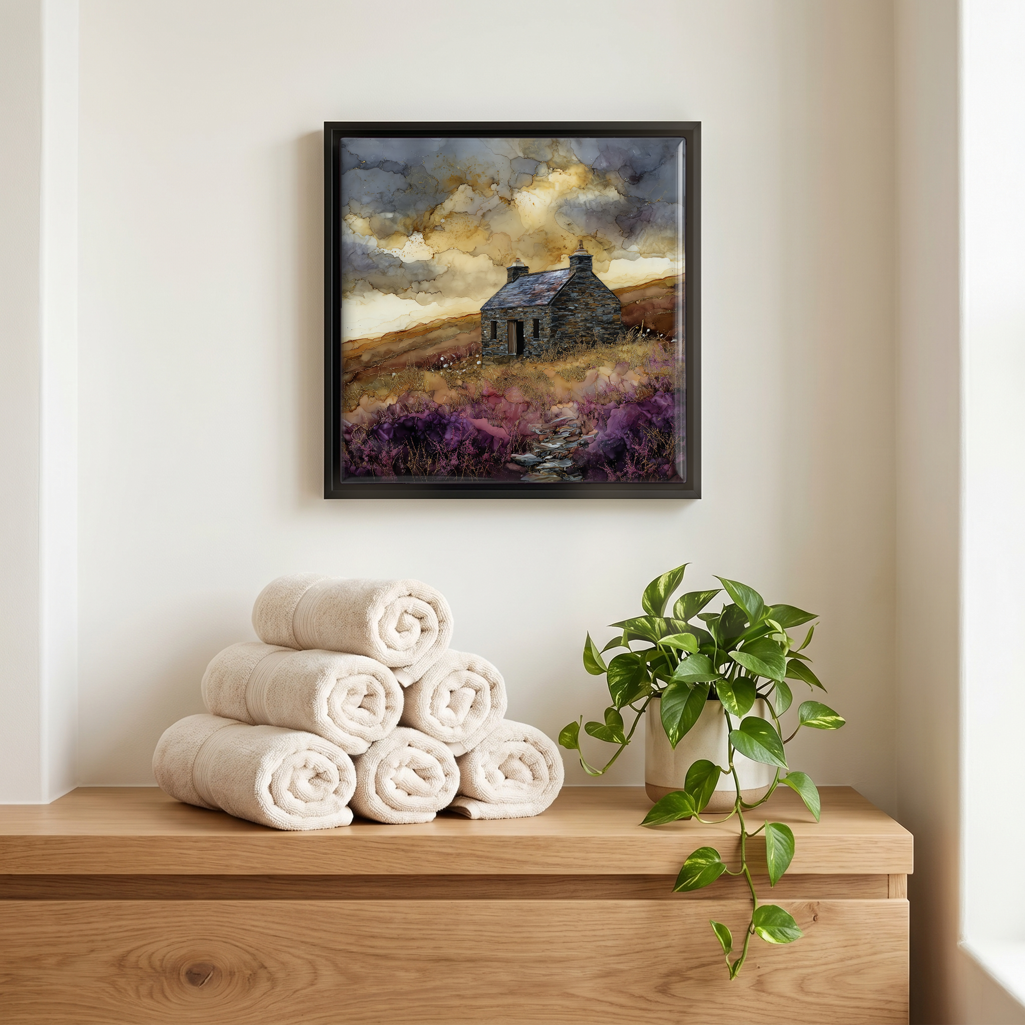 Above the linens, in a slim black surround.