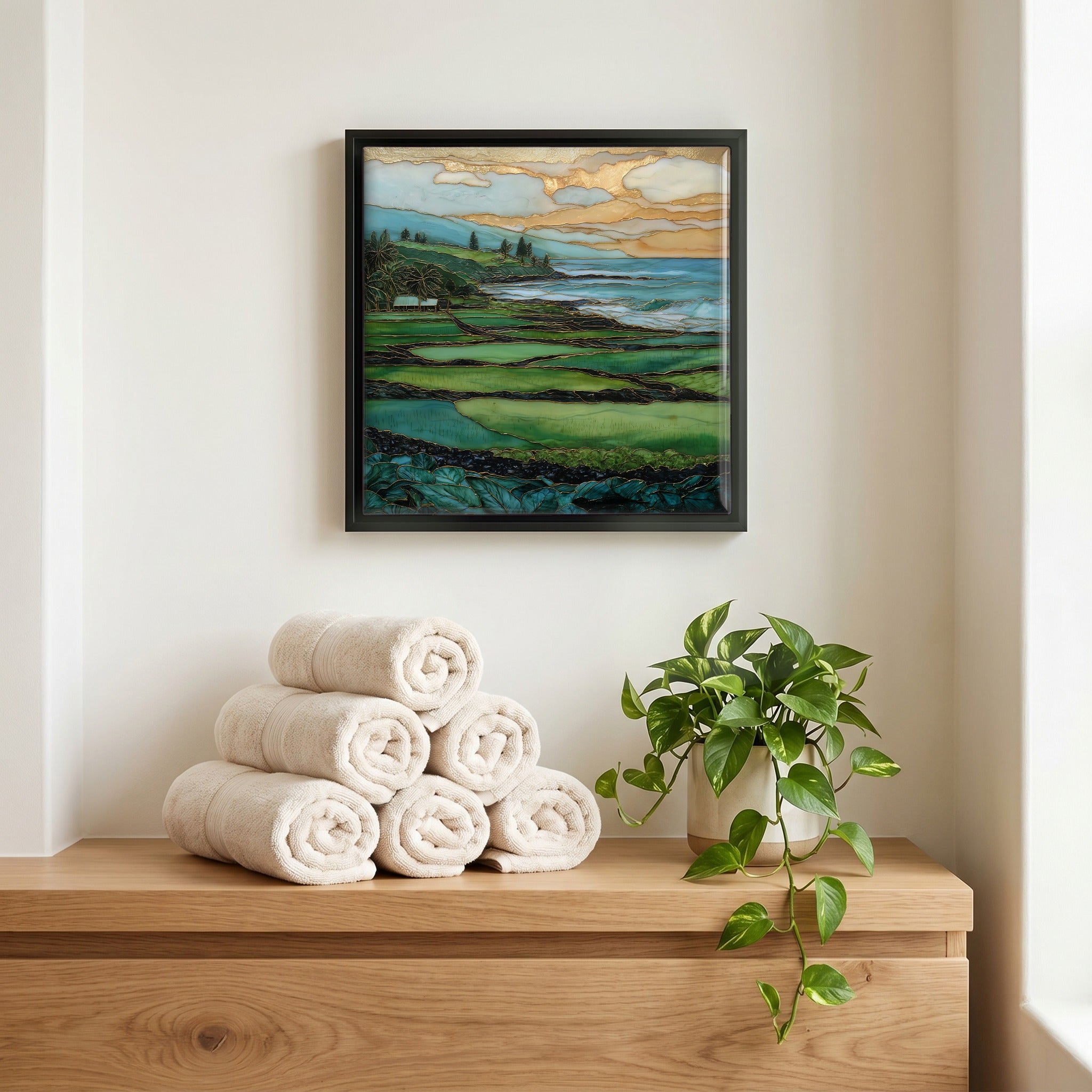 Above the linens, in a slim black surround.