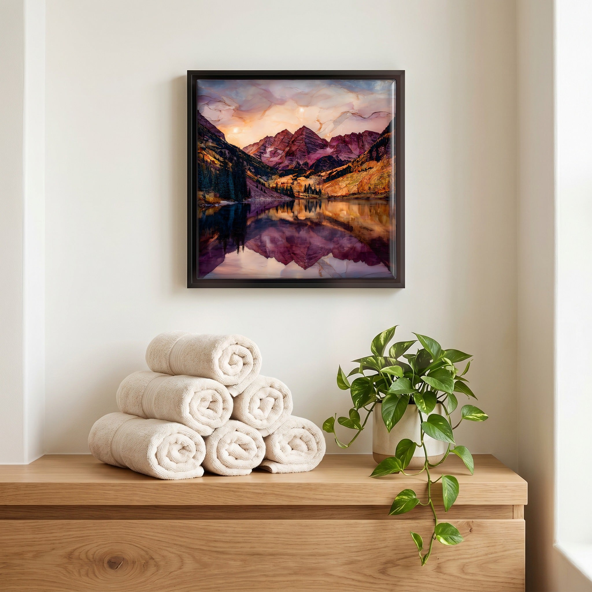 Above the linens, in a slim black surround.