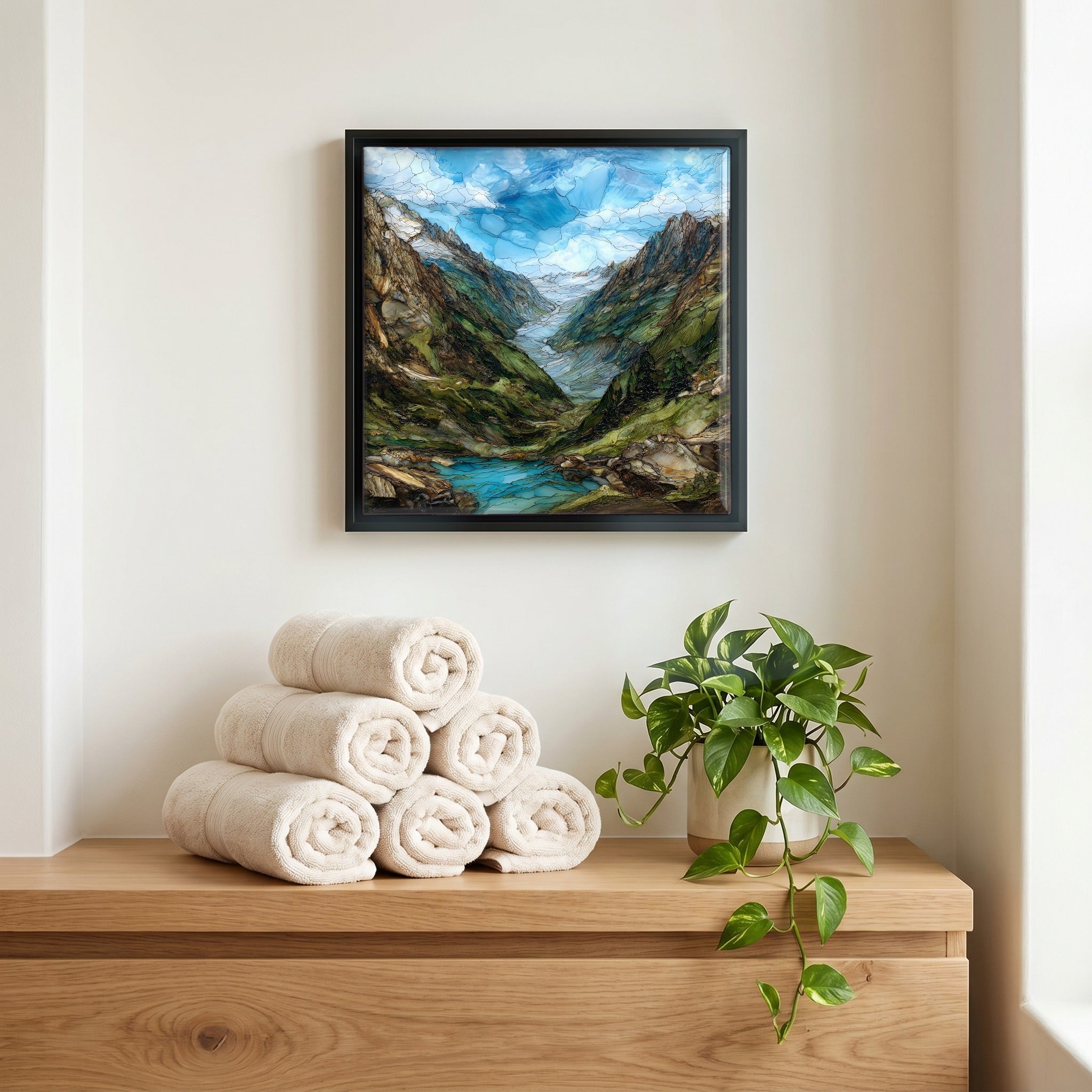 Above the linens, in a slim black surround.