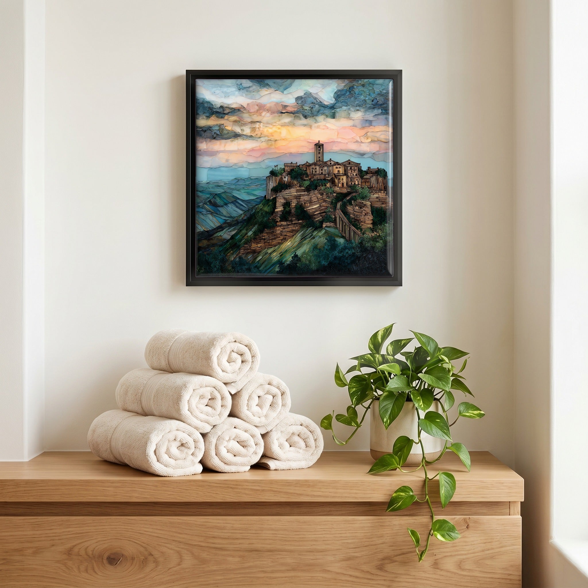 Above the linens, in a slim black surround.