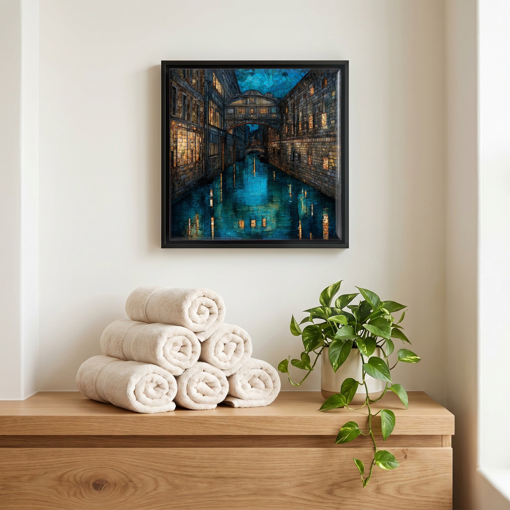 Above the linens, in a slim black surround.